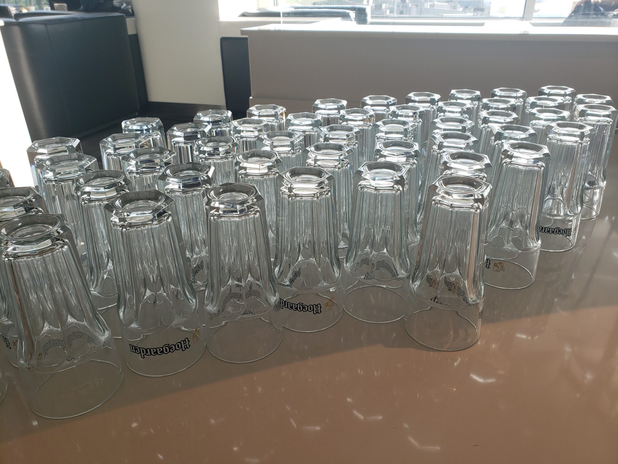 a group of clear glasses on a table