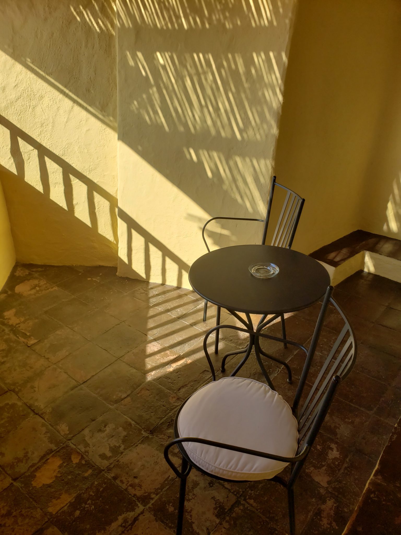 a table and chairs on a patio