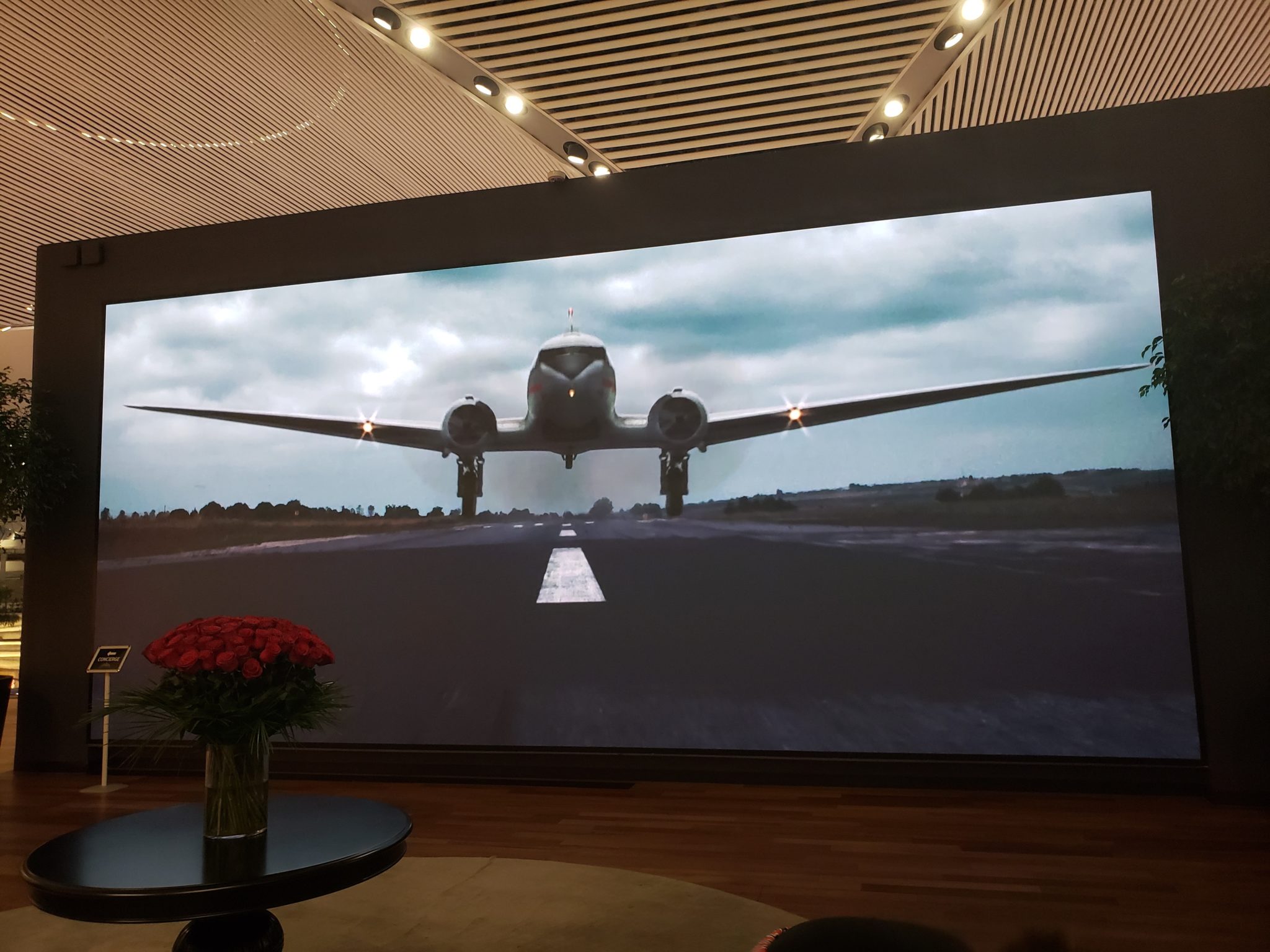 a large screen with a picture of an airplane on it