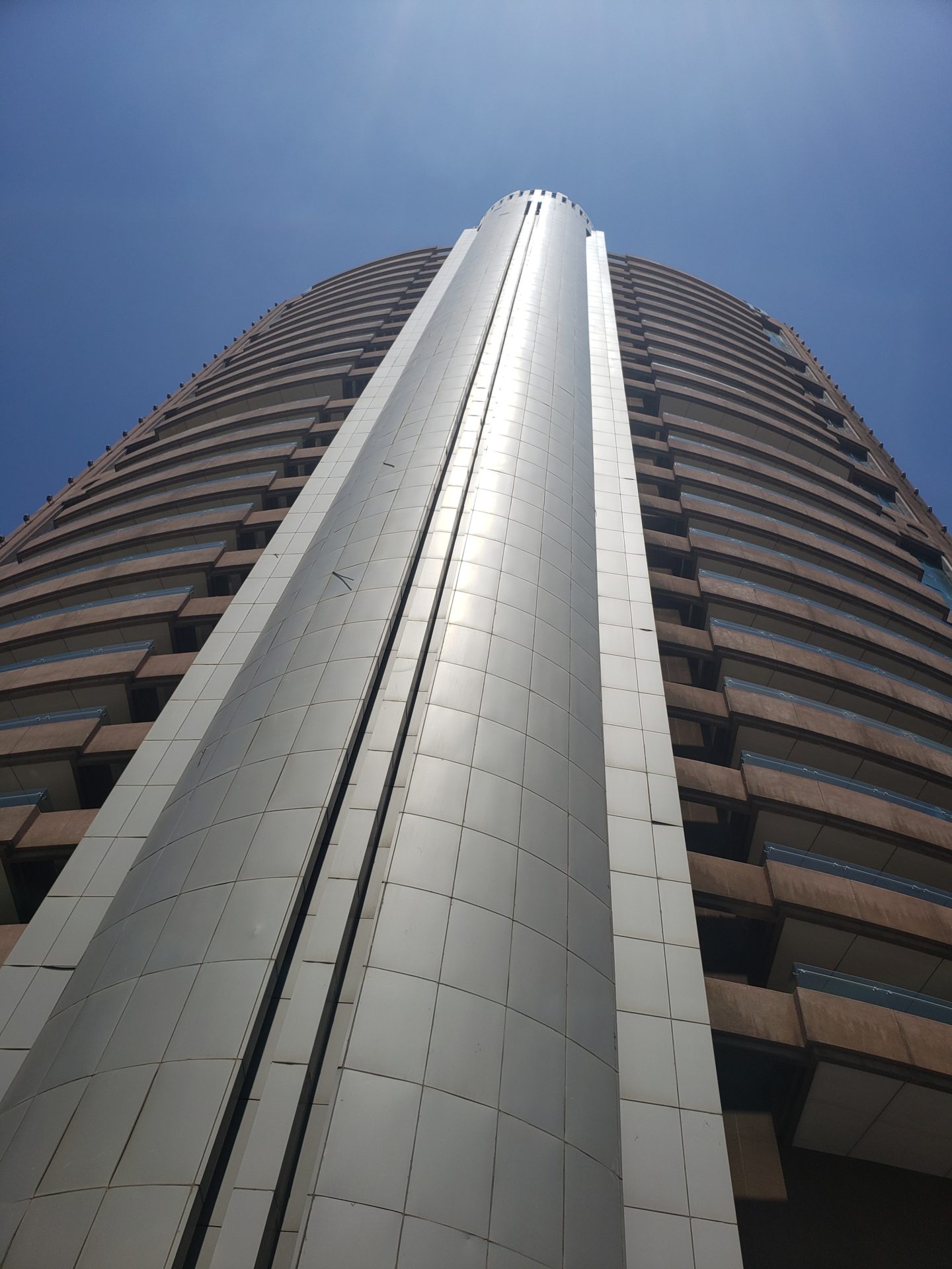 a tall building with a tall cylindrical tower