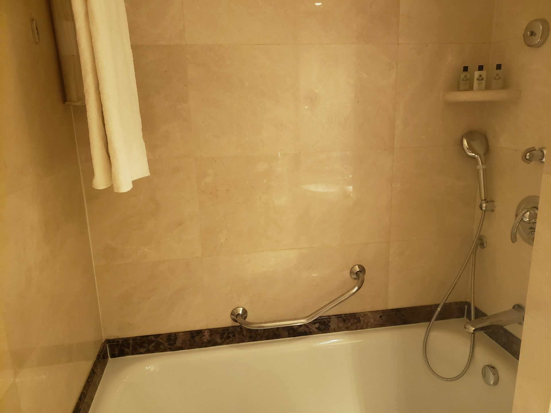 a bathtub and shower in a bathroom
