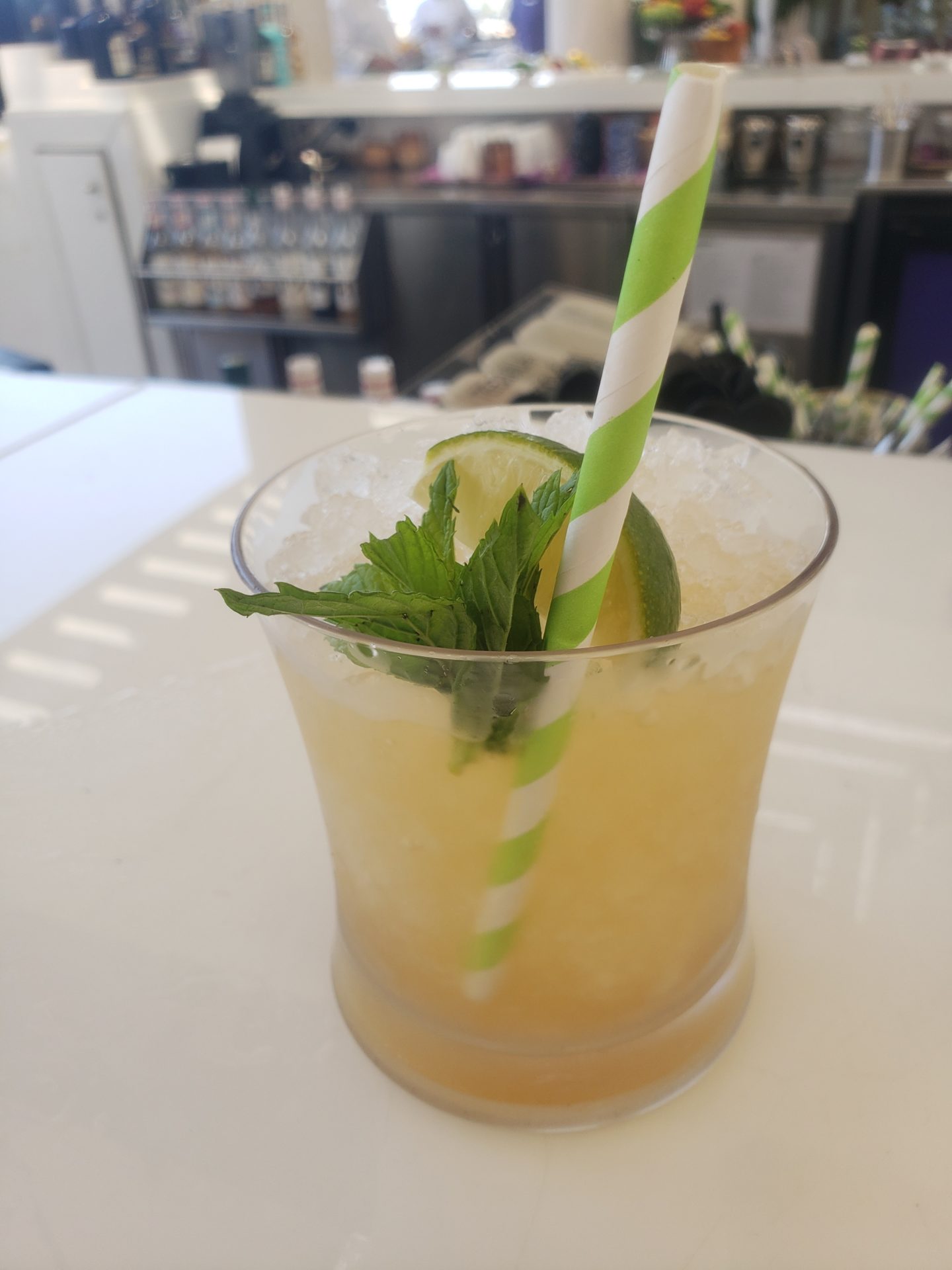 a drink with a straw and lime
