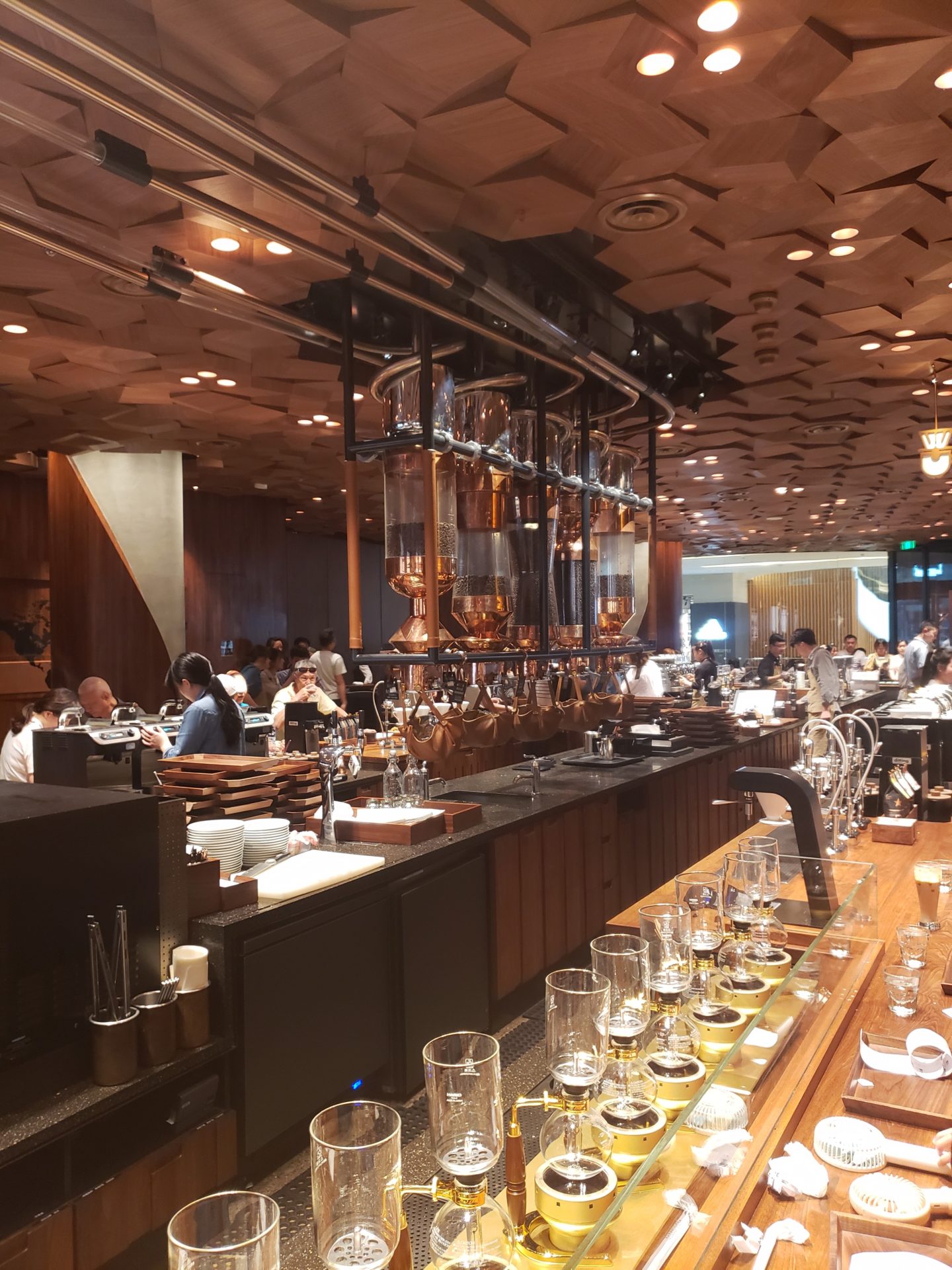 a large room with a bar and people in the background