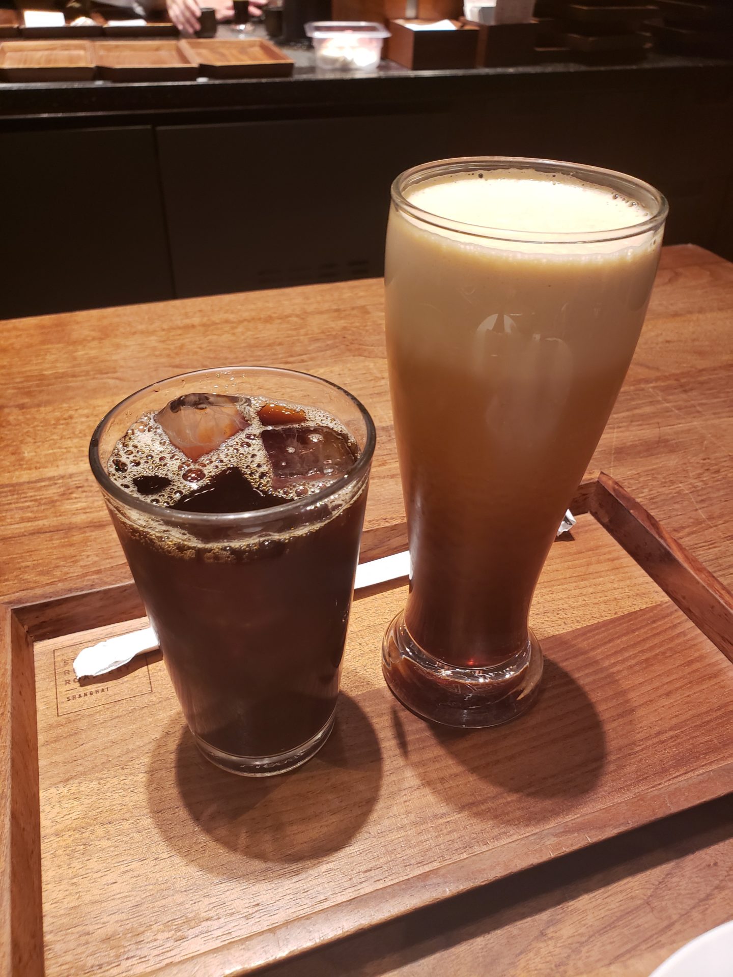a glass of liquid next to a glass of liquid