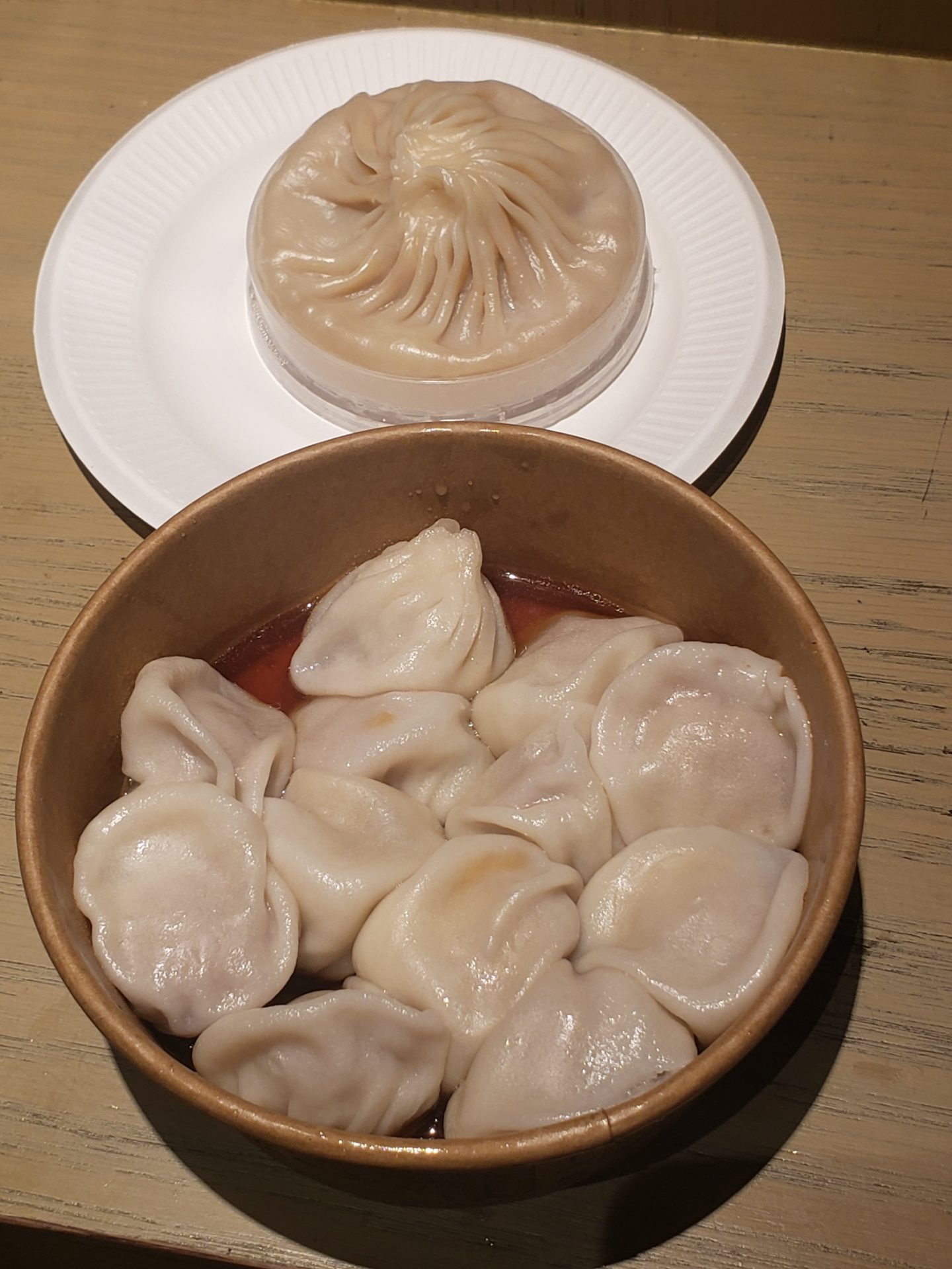 a bowl of dumplings on a plate