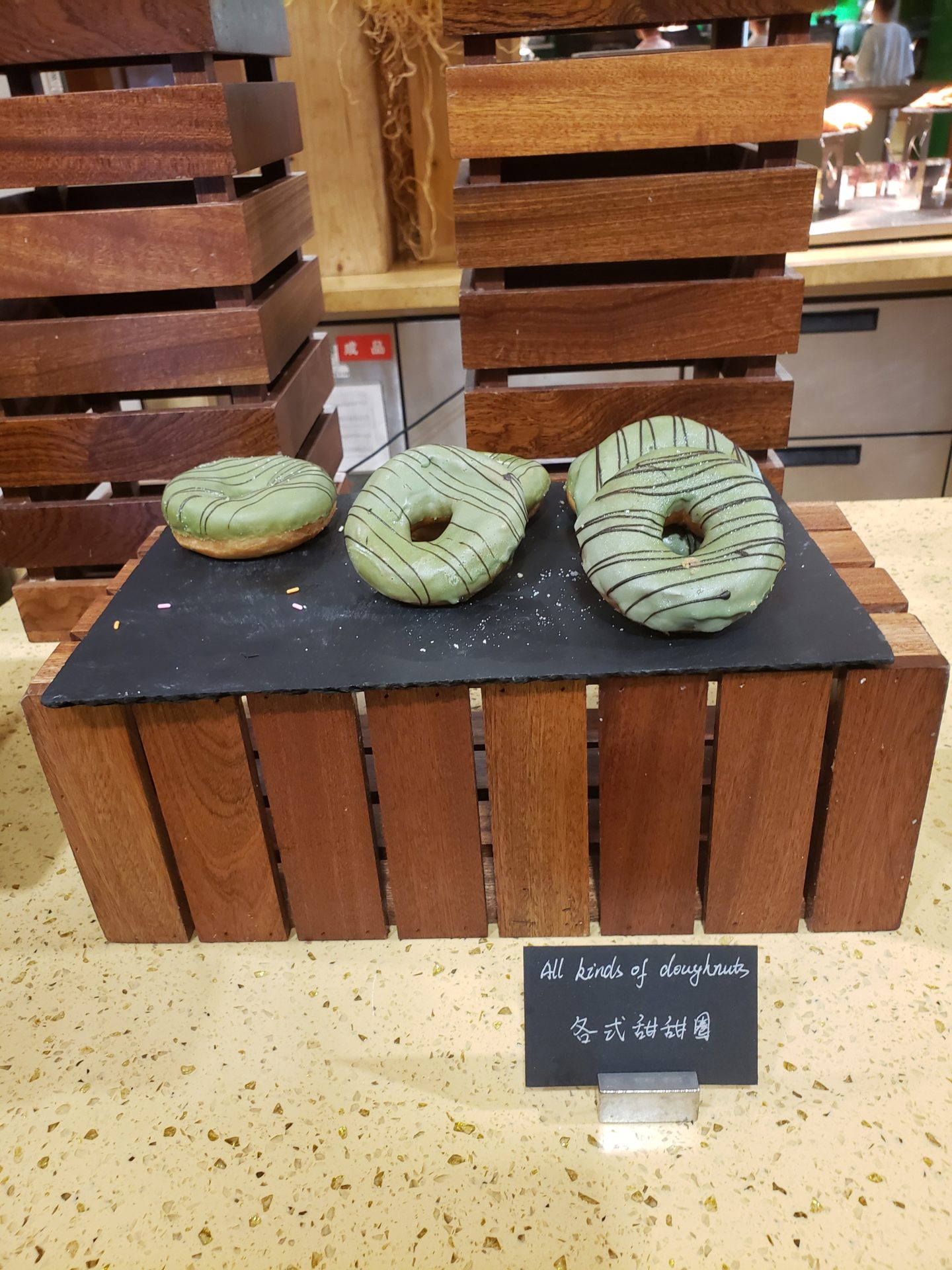 a group of donuts on a wooden box