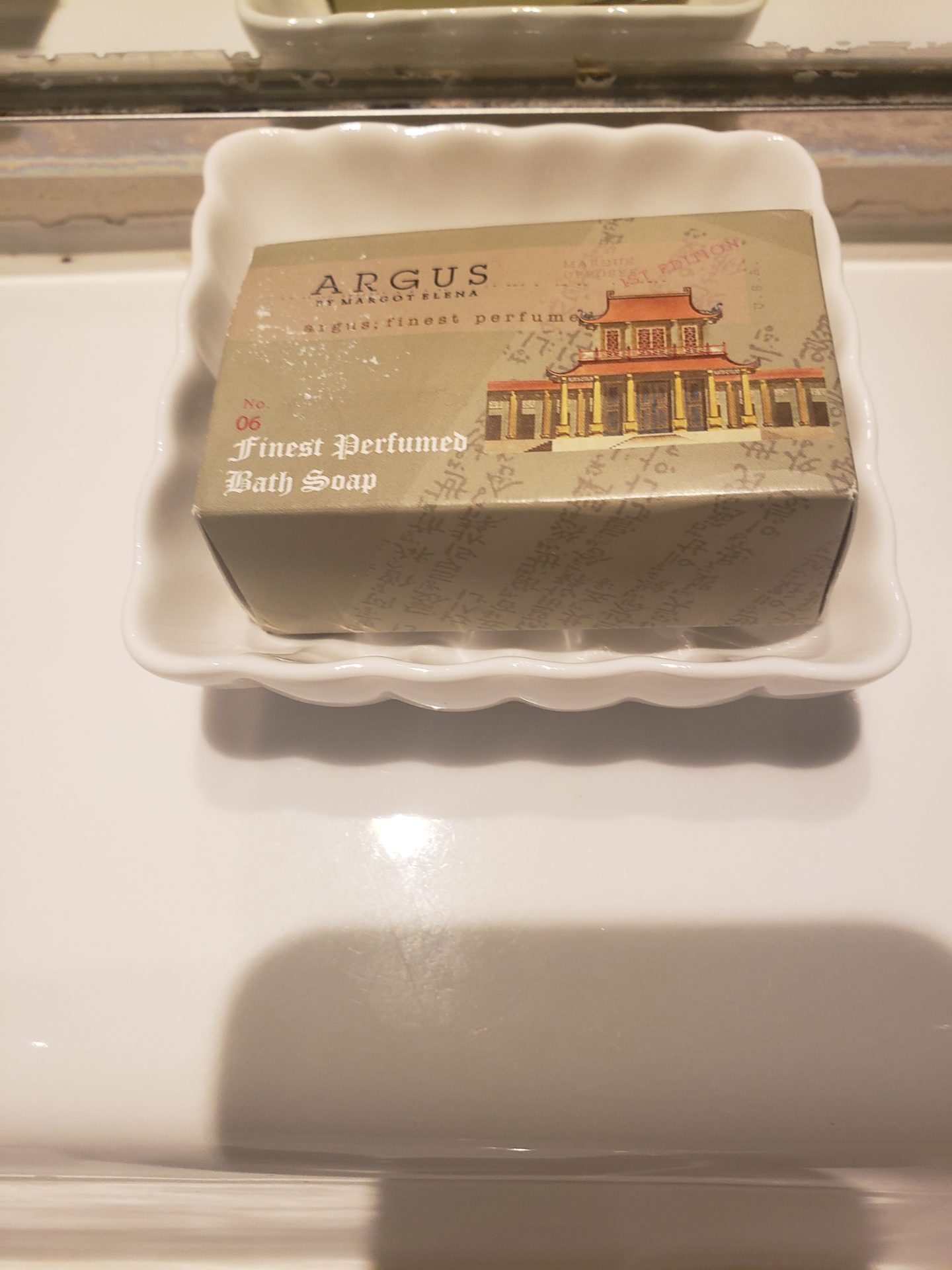 a box of soap in a white dish