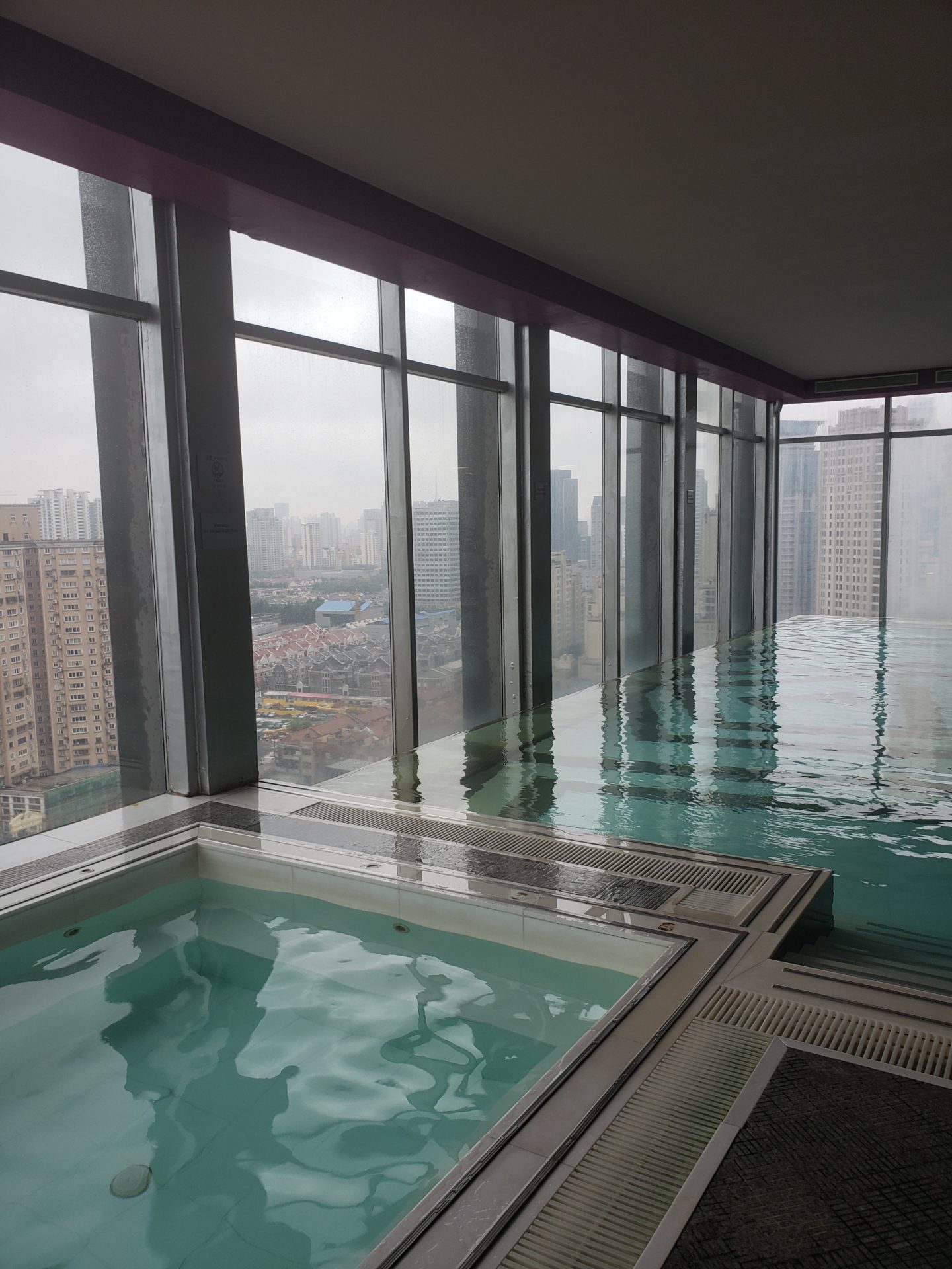 a pool with a view of a city
