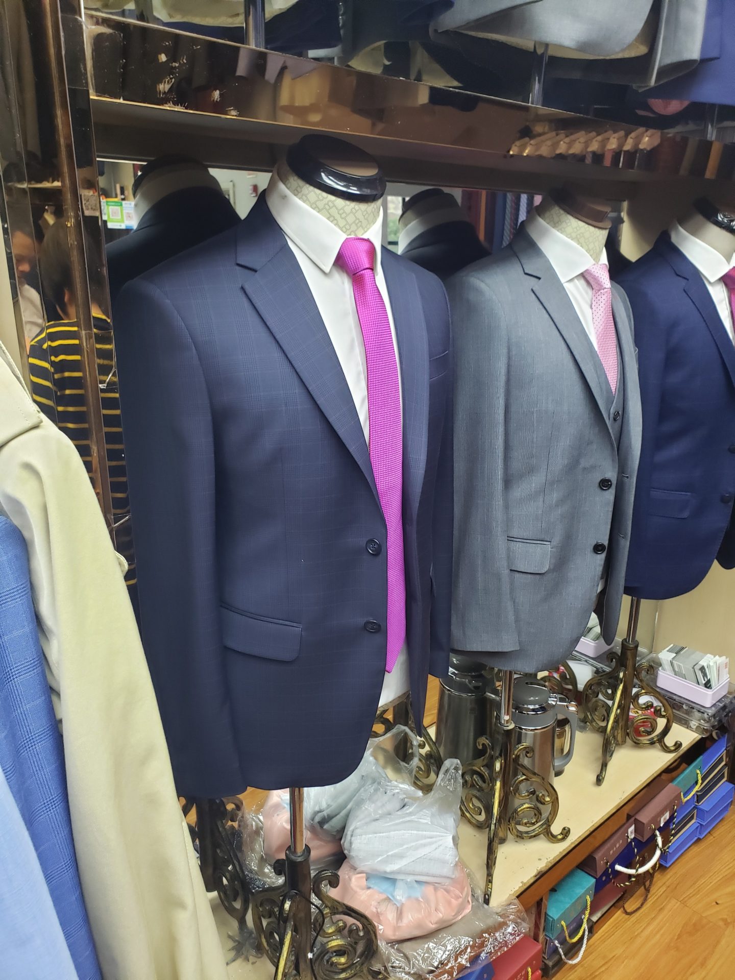 a mannequins with suits and ties