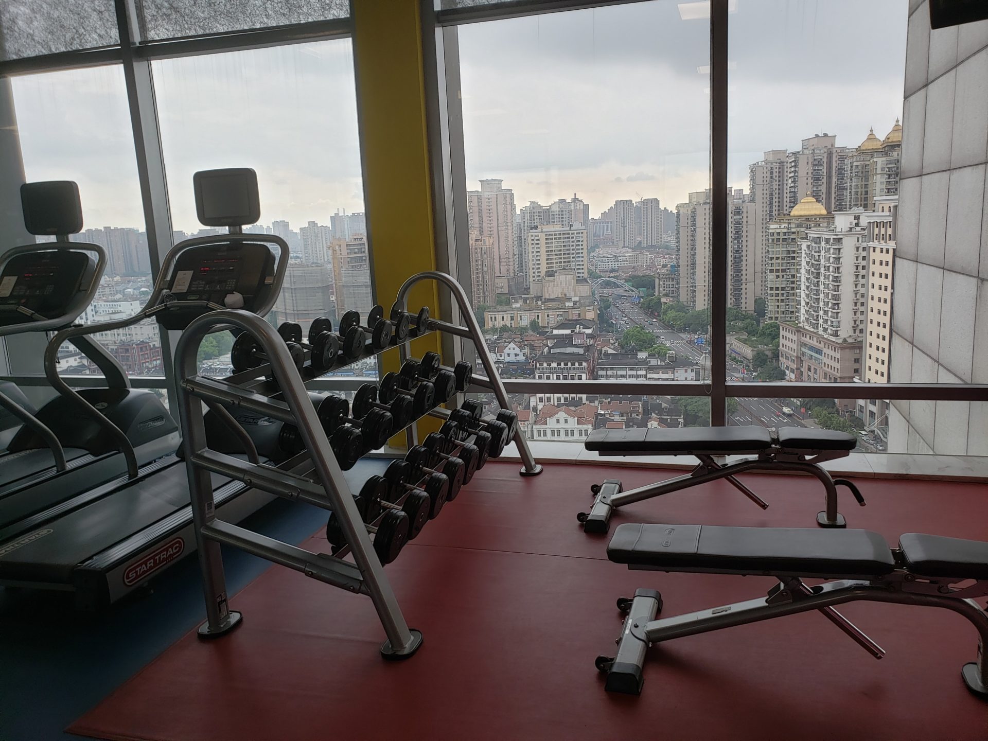 a gym with a view of a city
