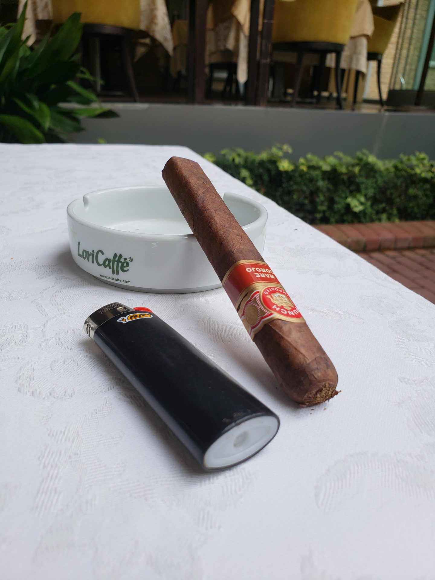 a cigar and lighter on a table