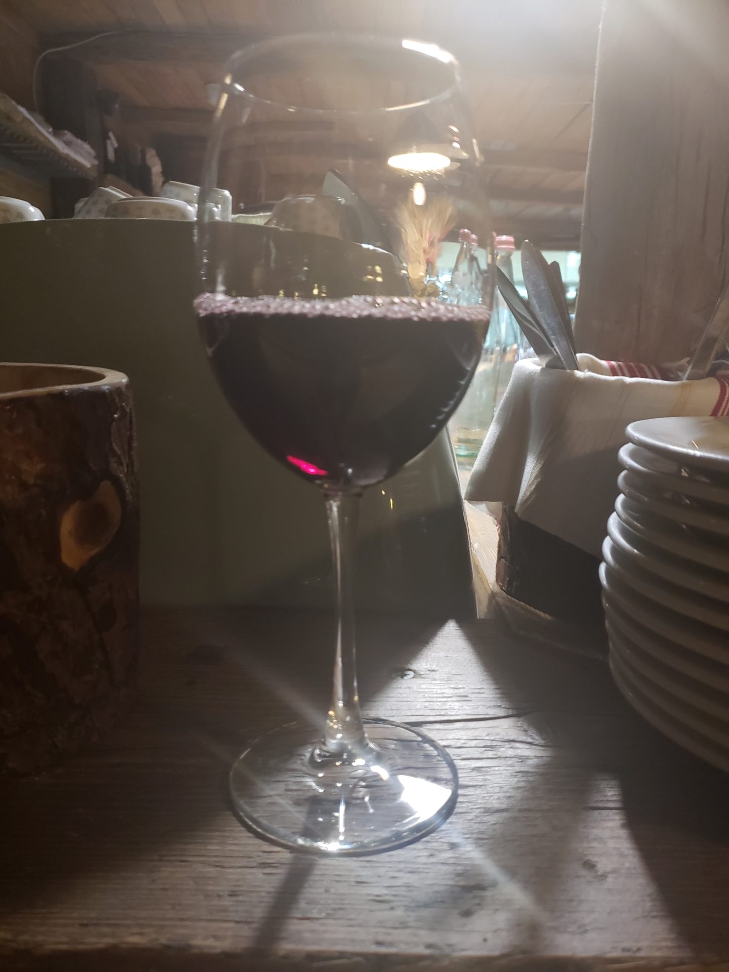 a glass of wine on a table