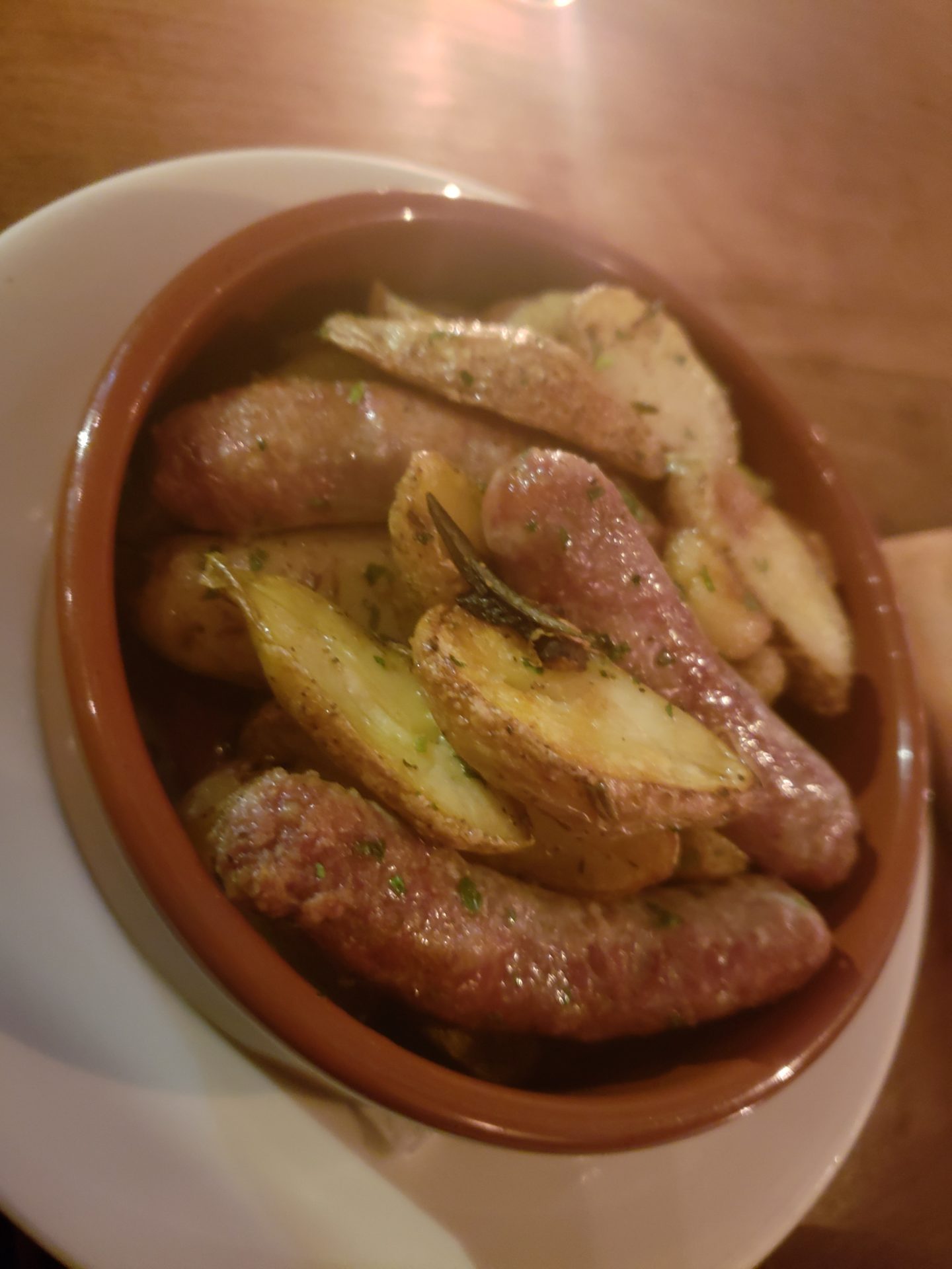 a bowl of sausages and potatoes