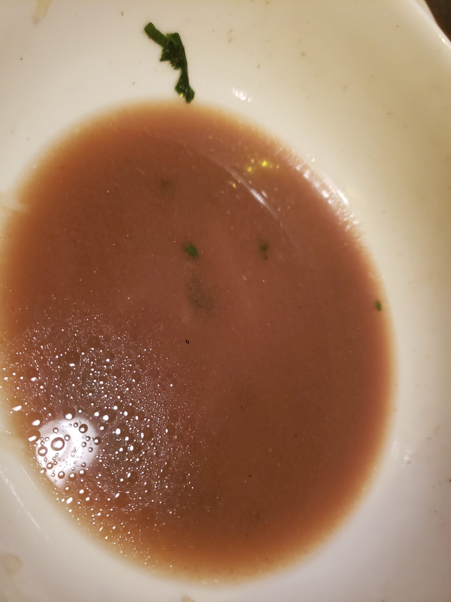 a bowl of brown liquid