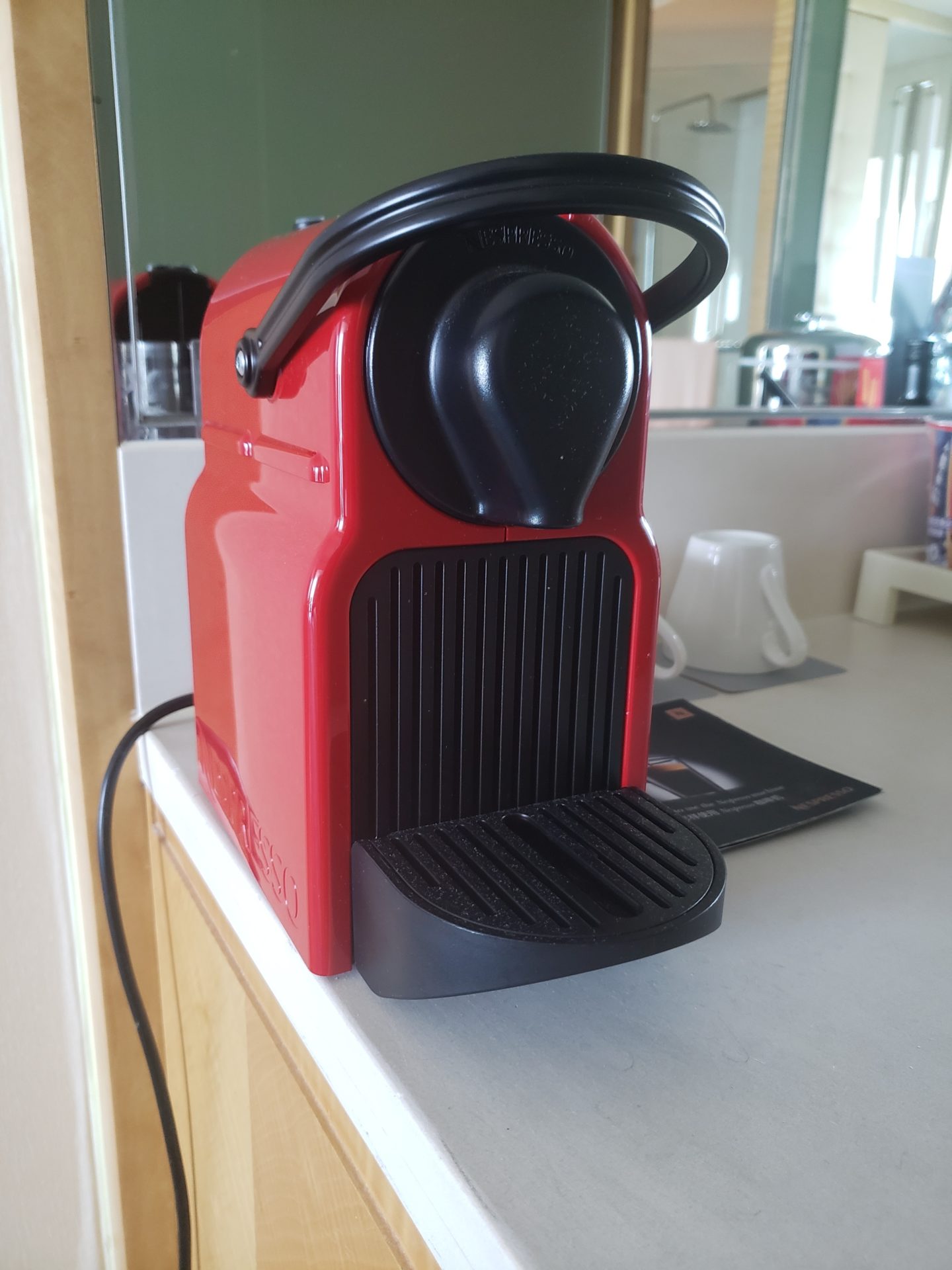 a red and black coffee machine