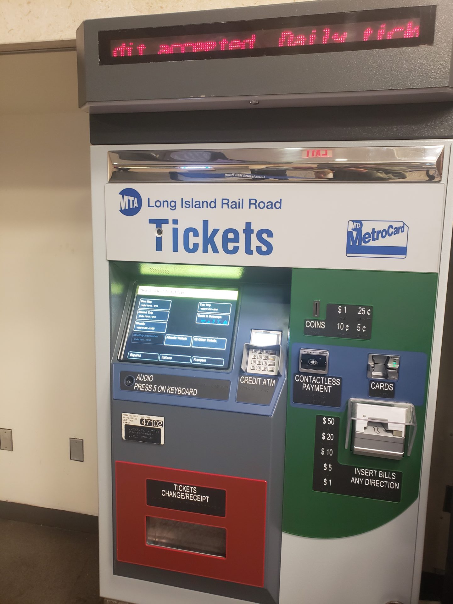 a machine with a screen and a ticket machine