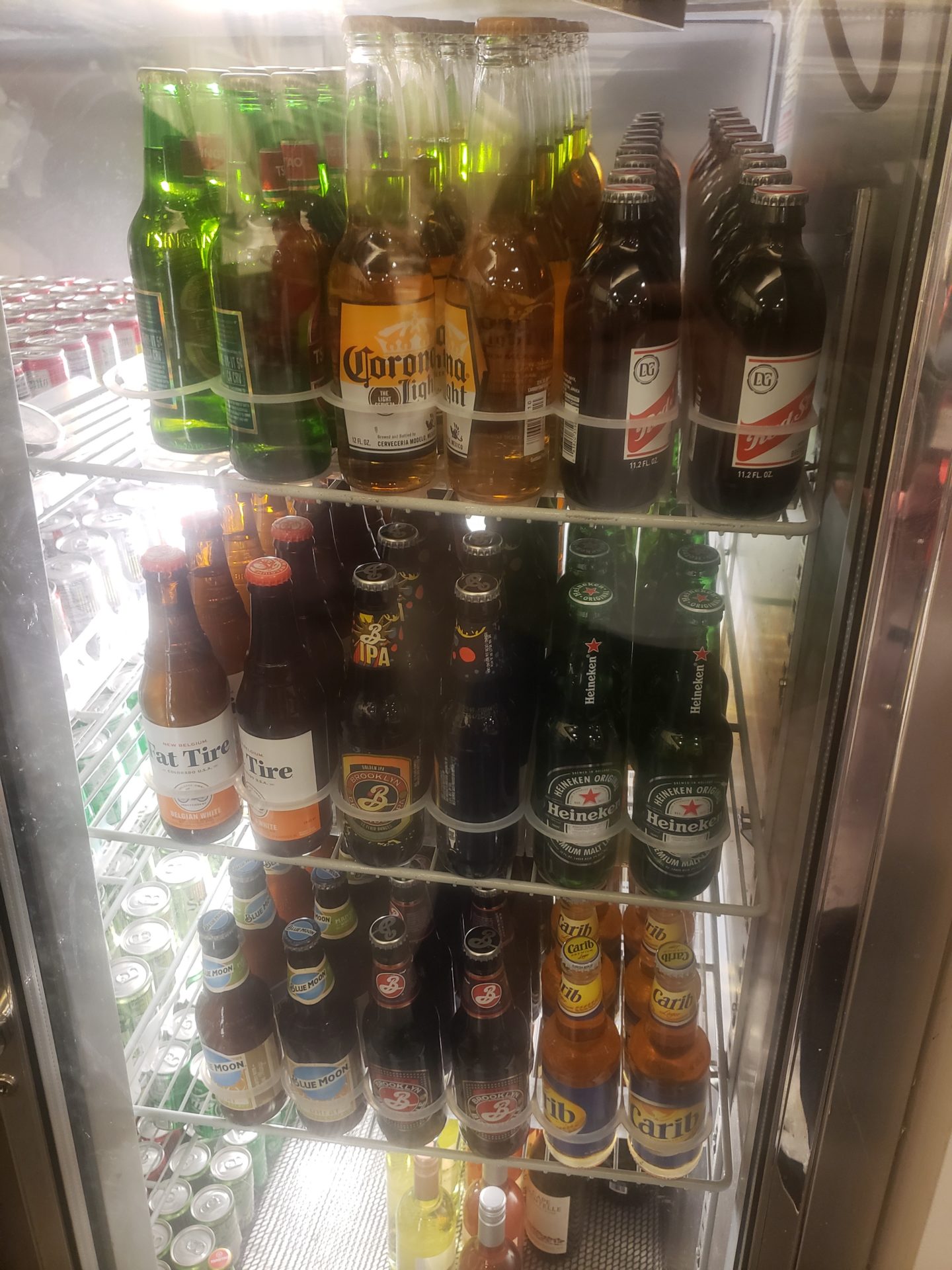 a refrigerator full of beer bottles
