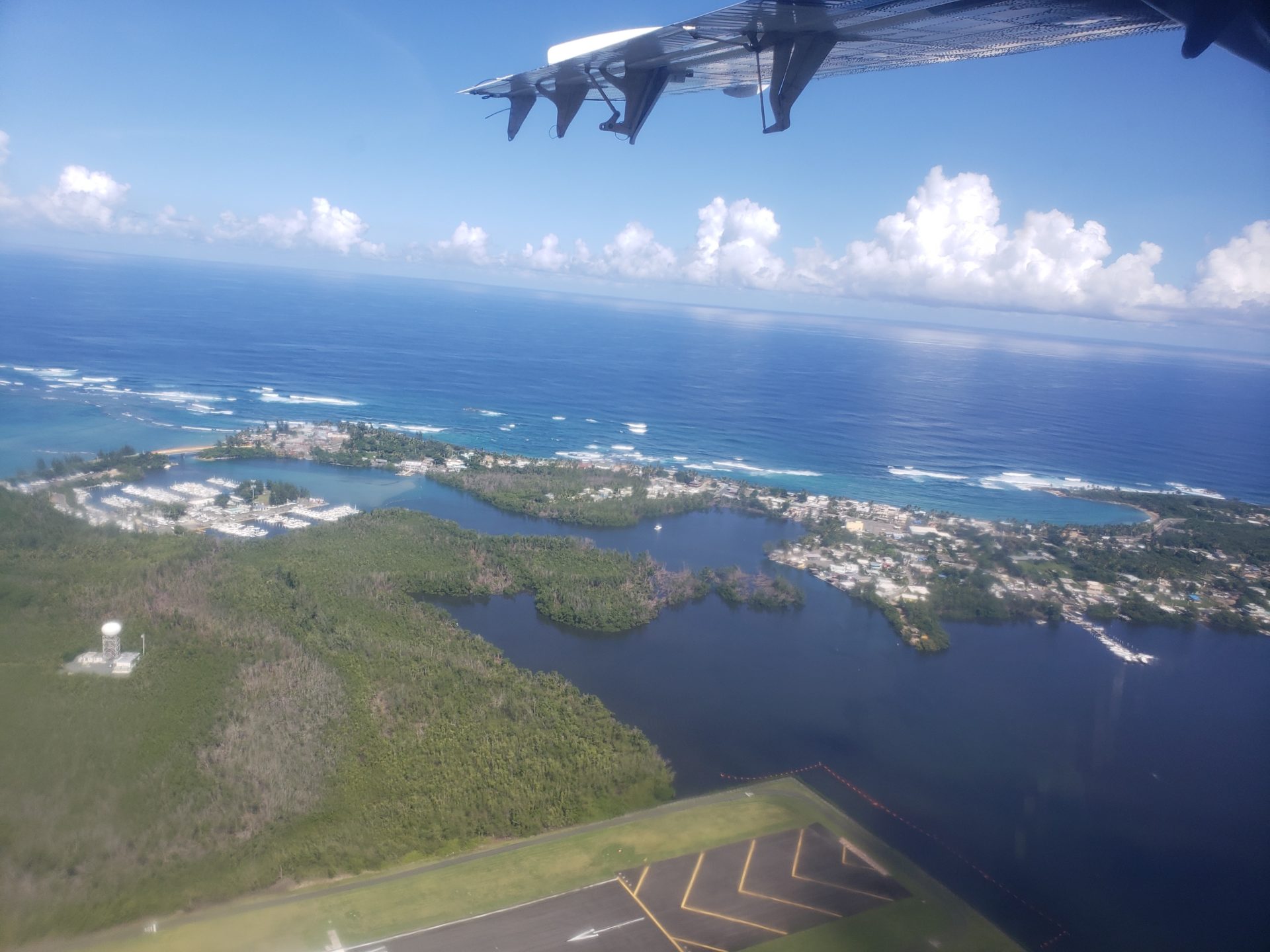 an airplane flying over a body of water