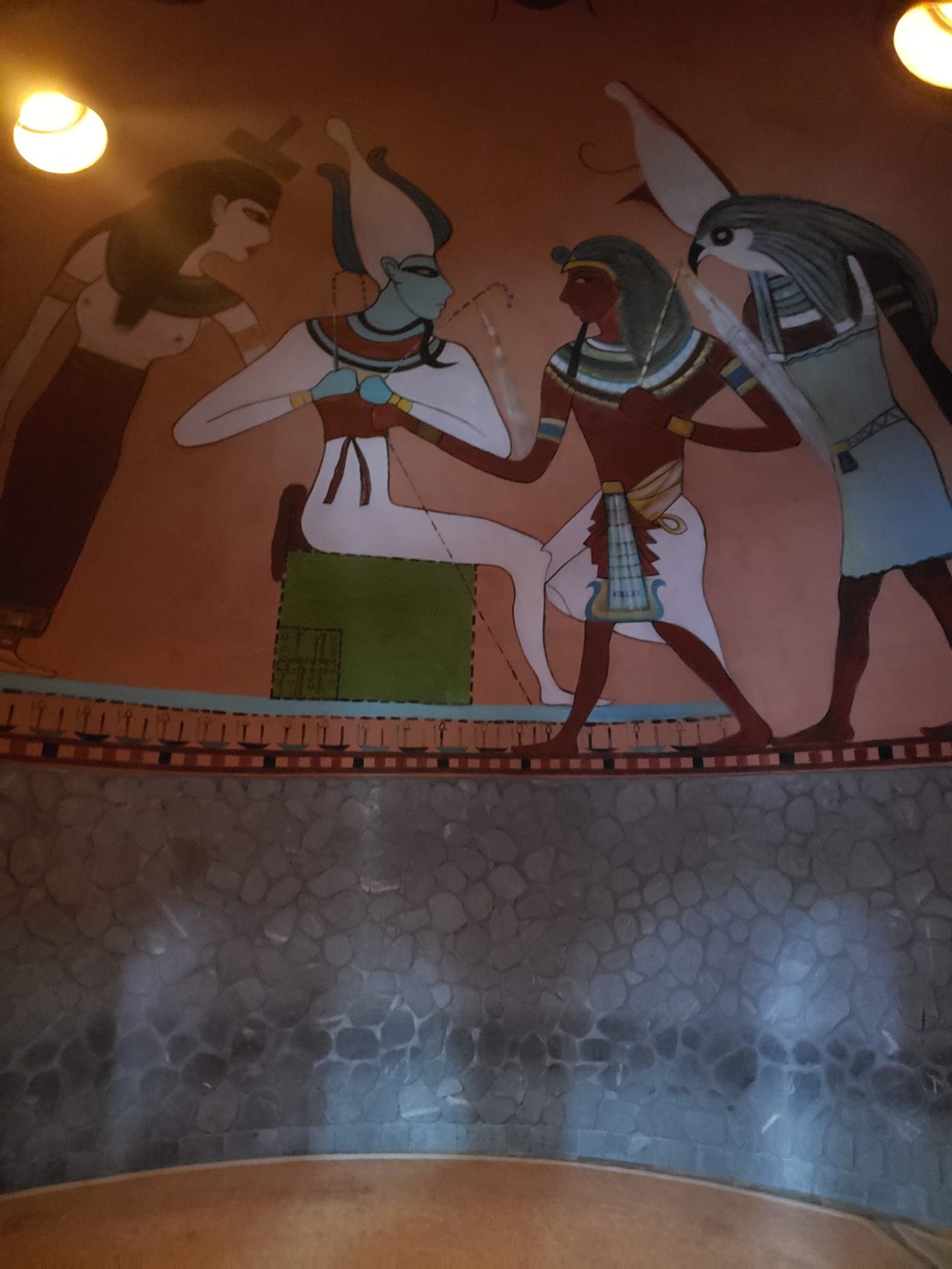a mural of egyptian gods and women