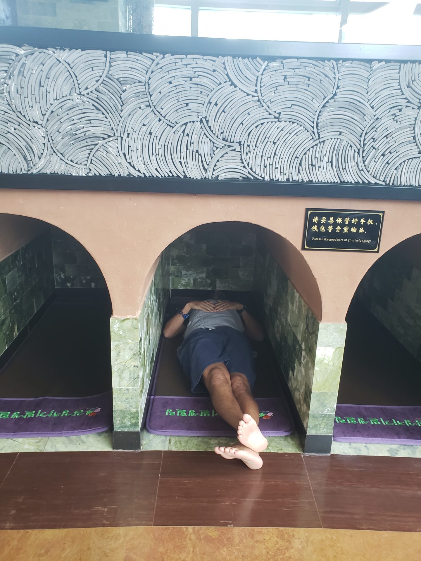 a person lying in a tunnel