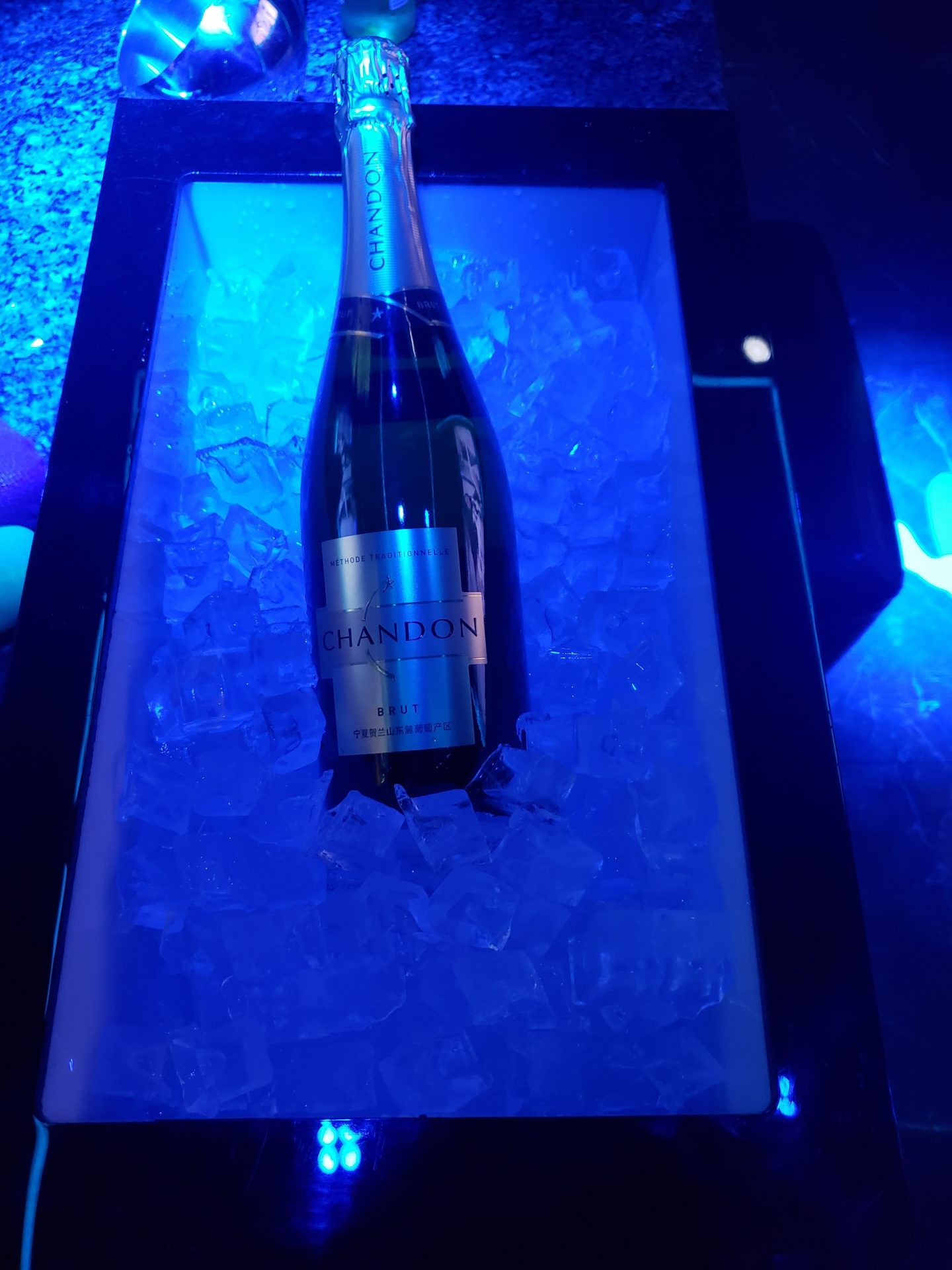 a bottle of champagne in ice