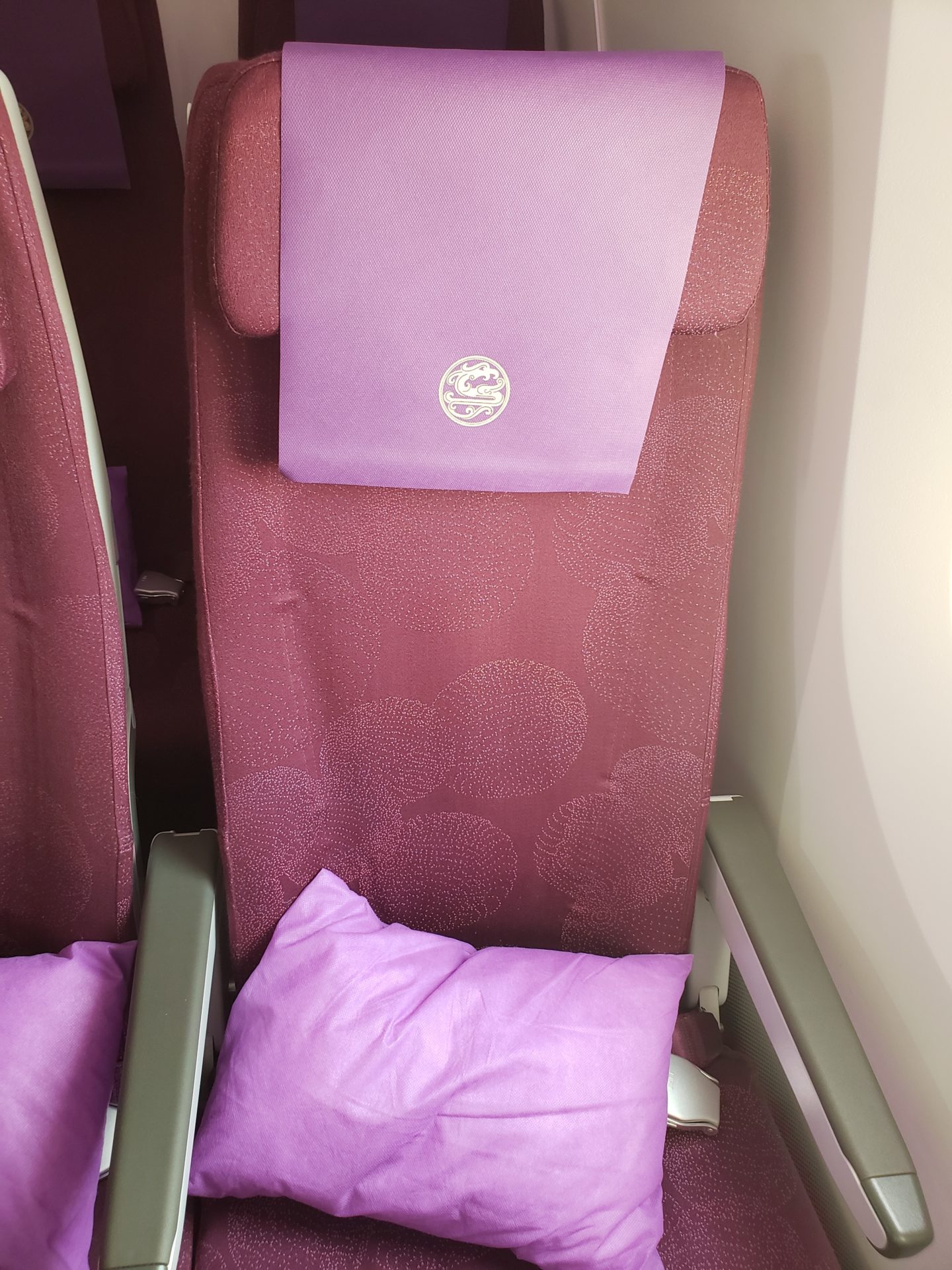 a purple pillow on a chair