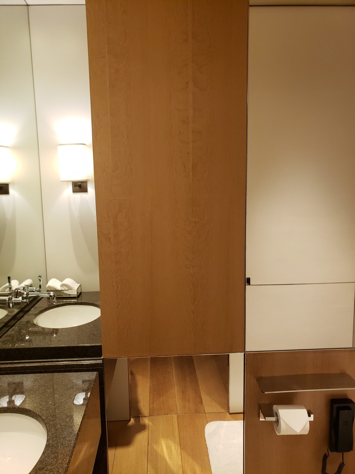a bathroom with a wood cabinet and sink