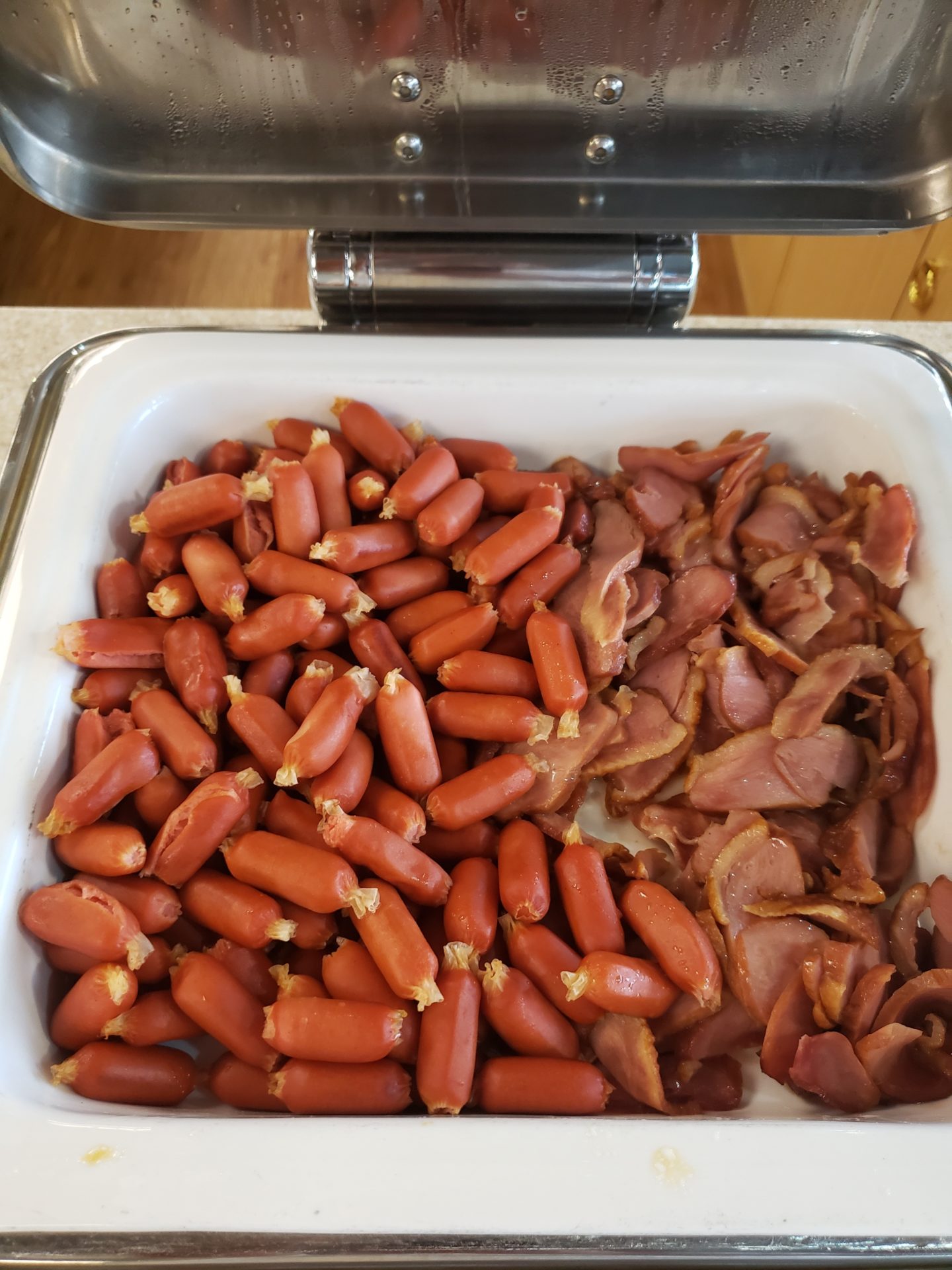 a bowl of sausages and bacon