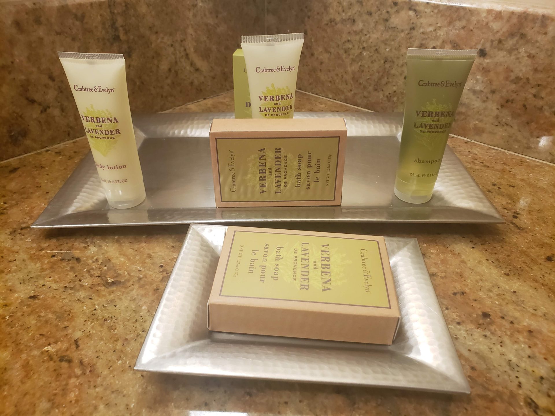 a group of bottles of body care products on a tray