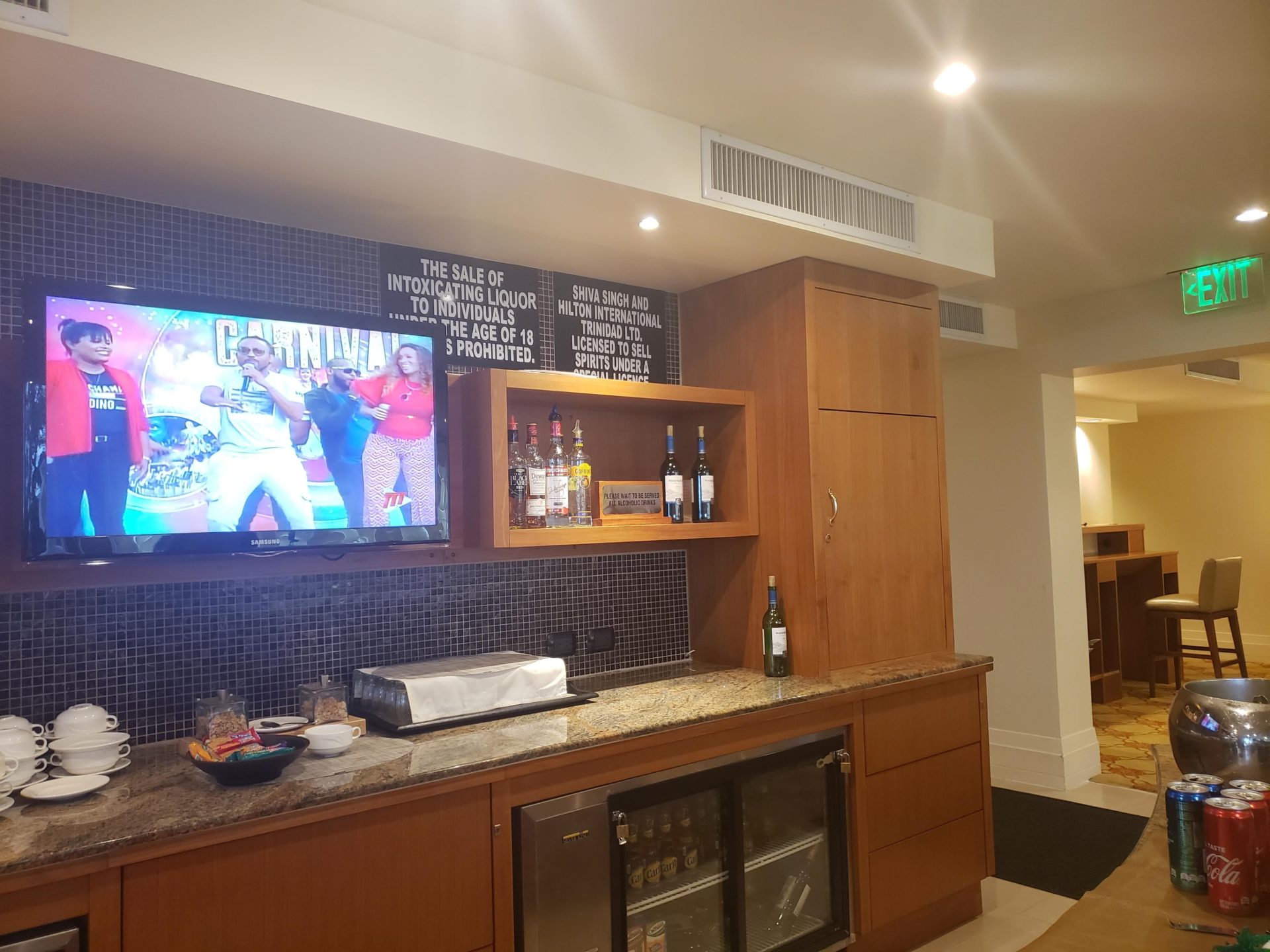 a bar with a television and a tv on the wall