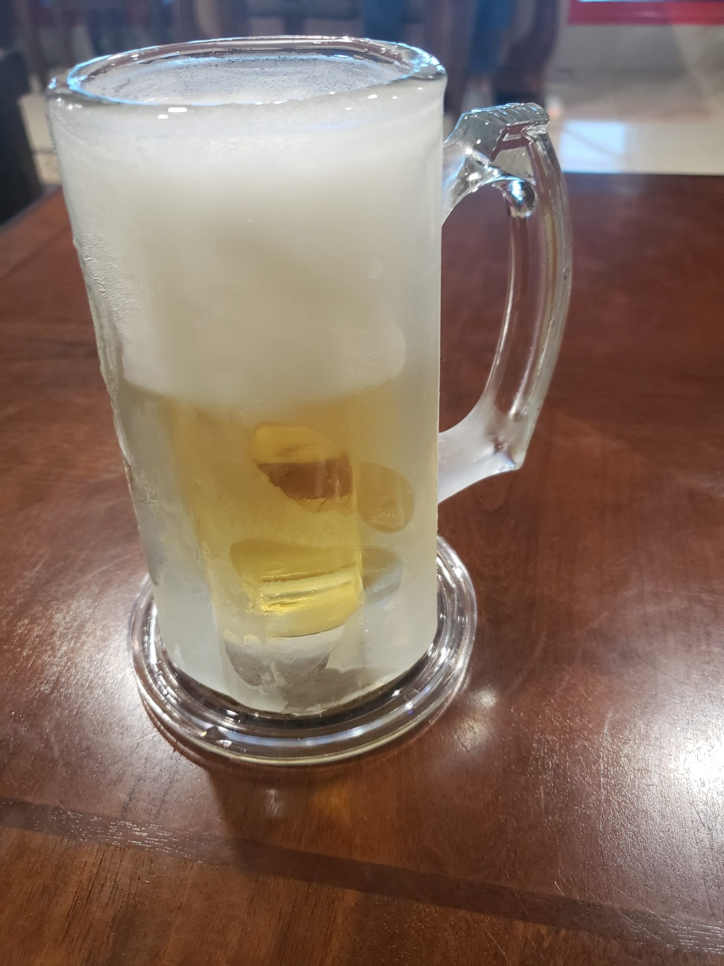 a glass mug with a liquid in it