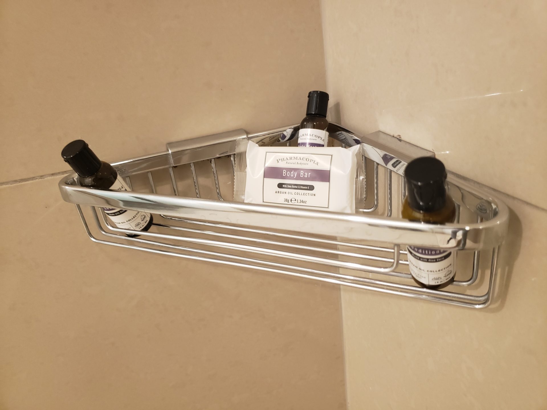 a shower caddy with bottles of shampoo and soap