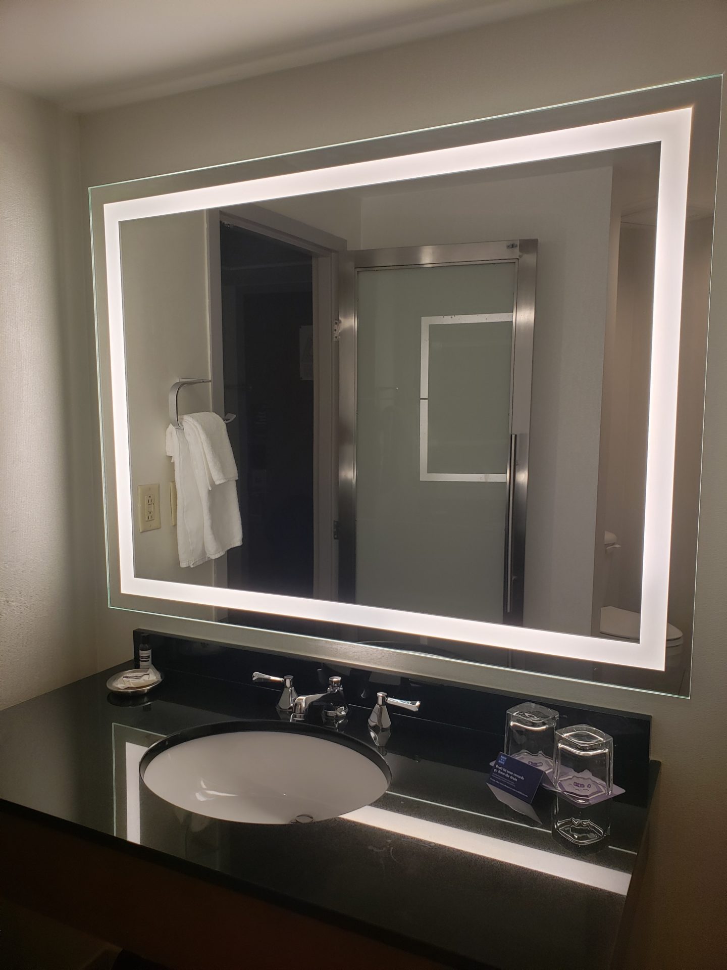 a mirror above a sink