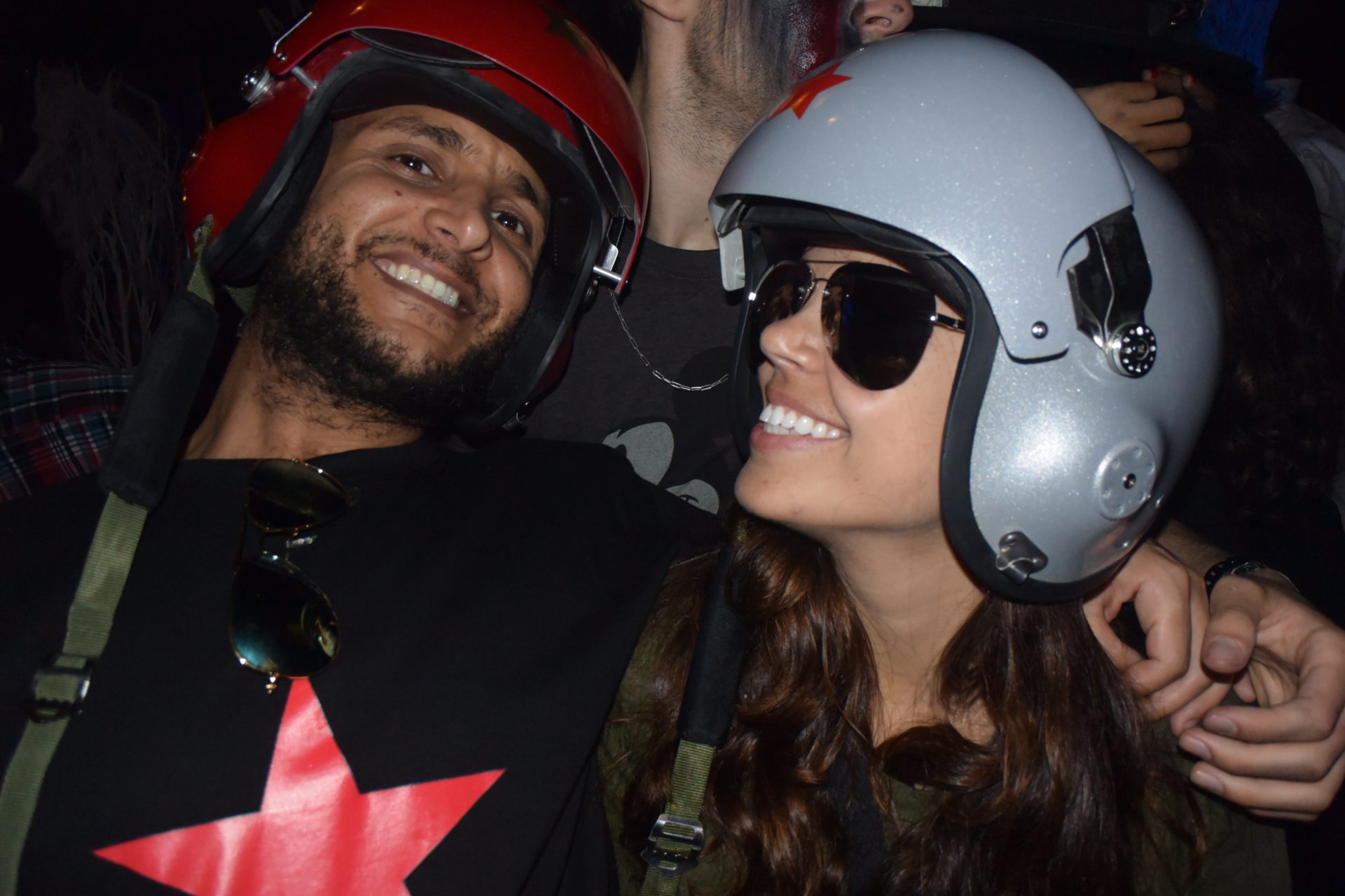 a man and woman wearing helmets