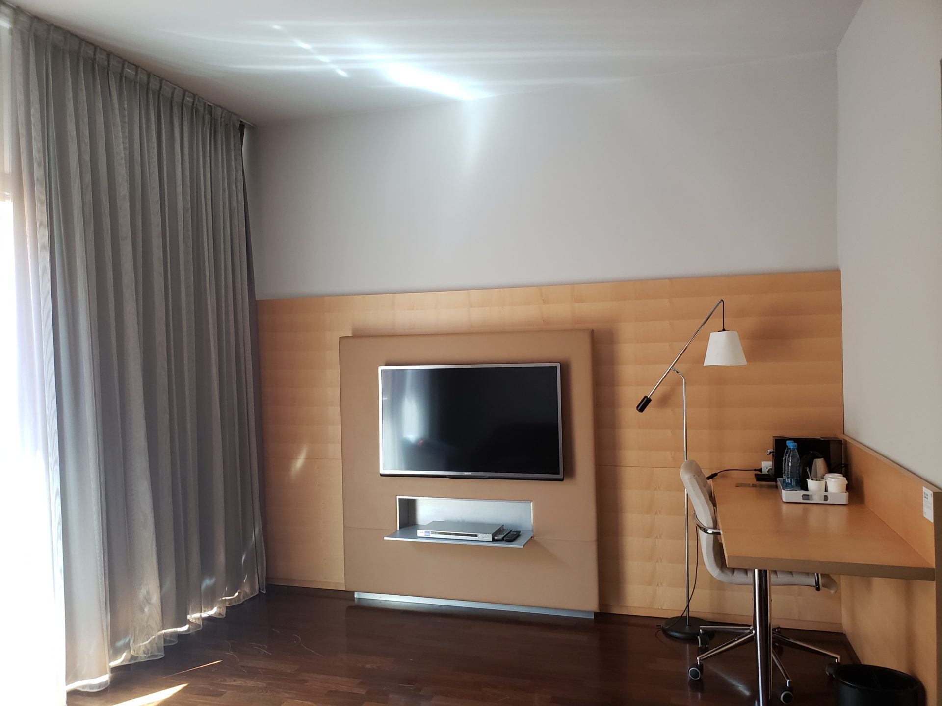 a room with a table and a tv