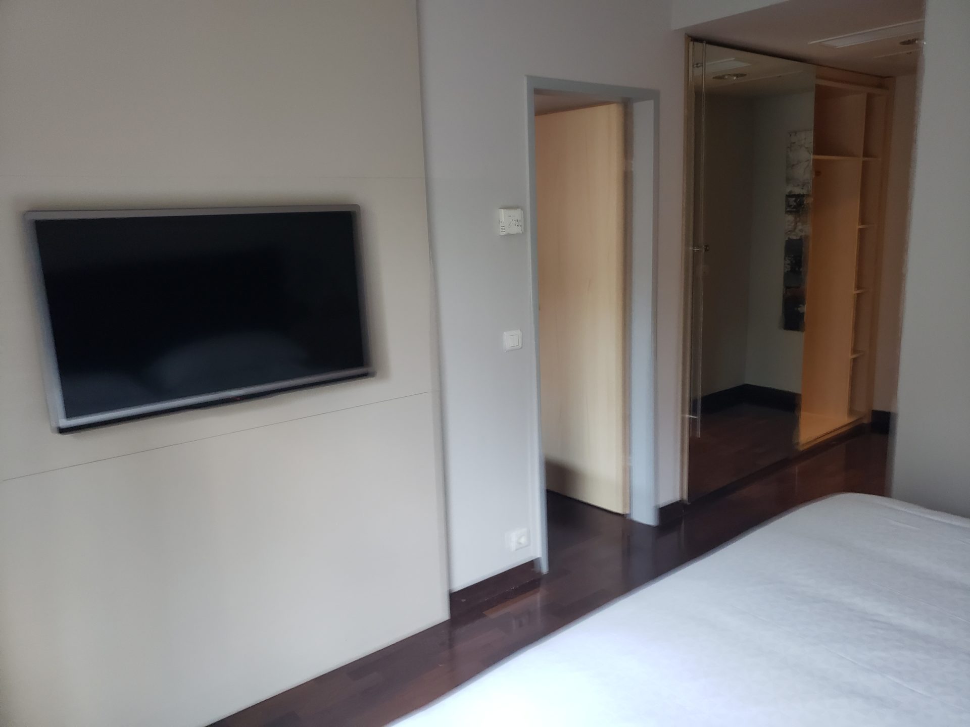 a tv on a wall in a room