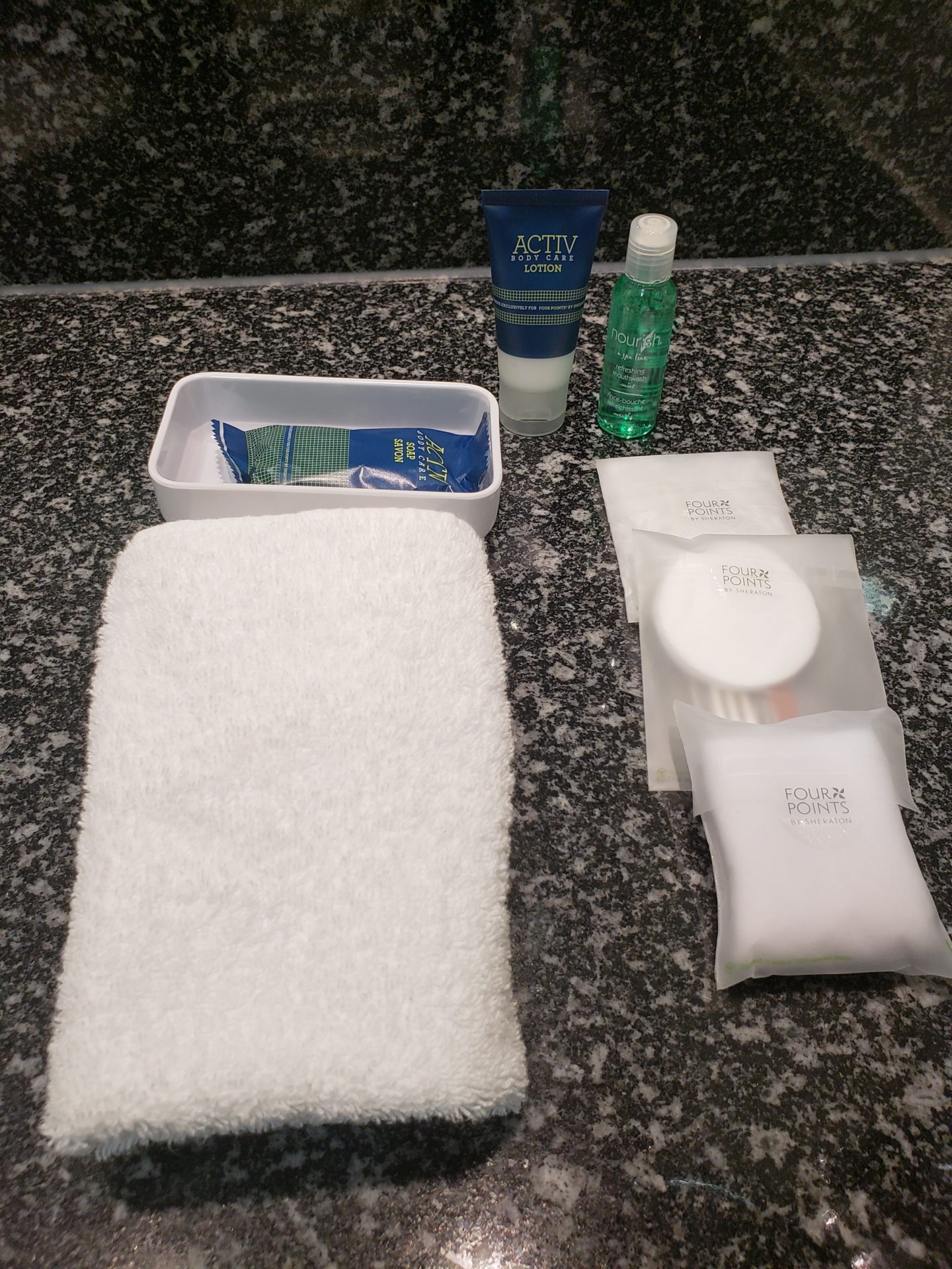 a group of toiletries and a towel