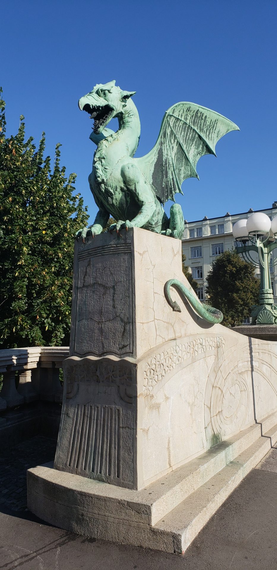a statue of a dragon on a stone platform