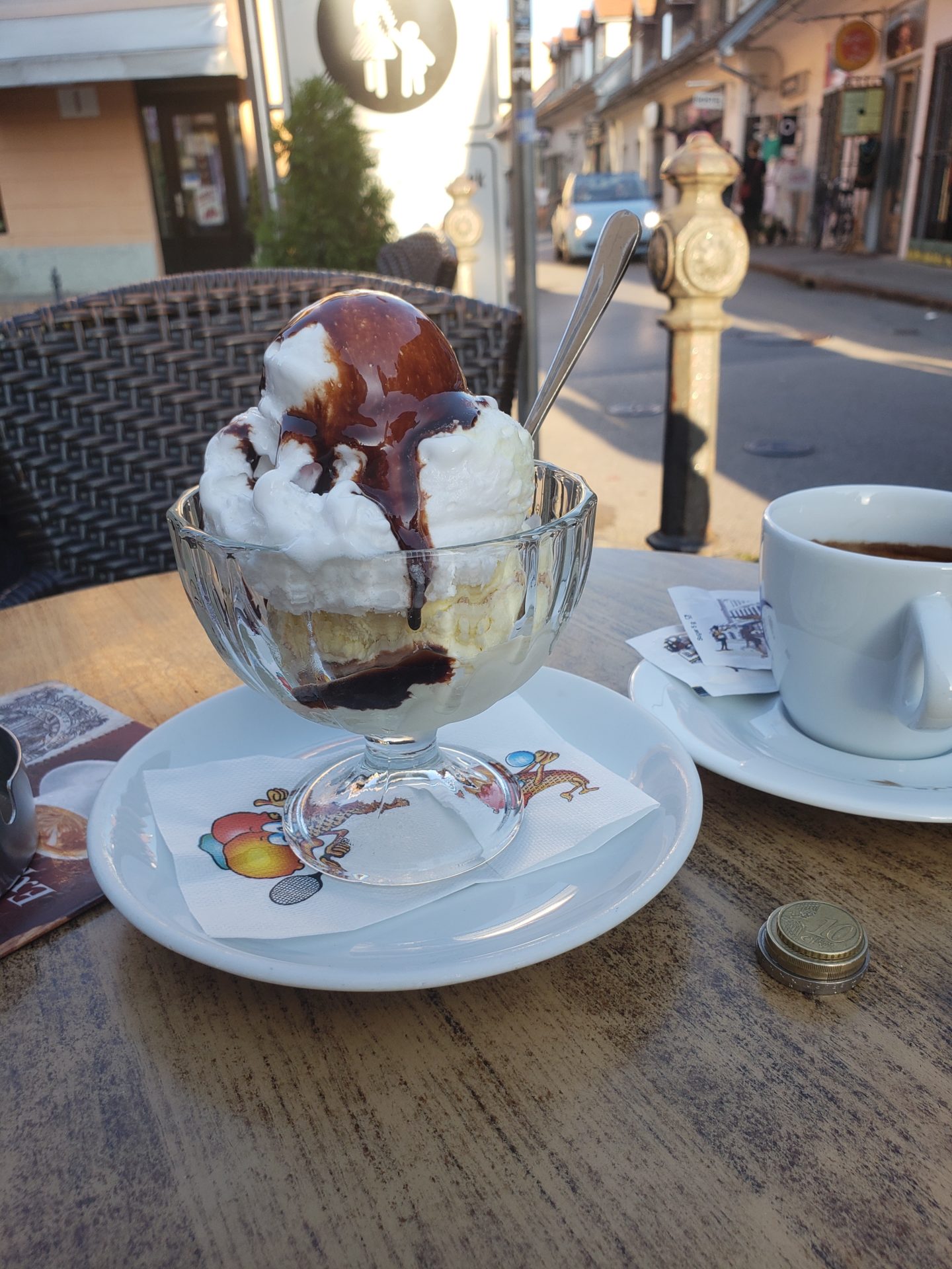 a sundae with ice cream and chocolate sauce on a table