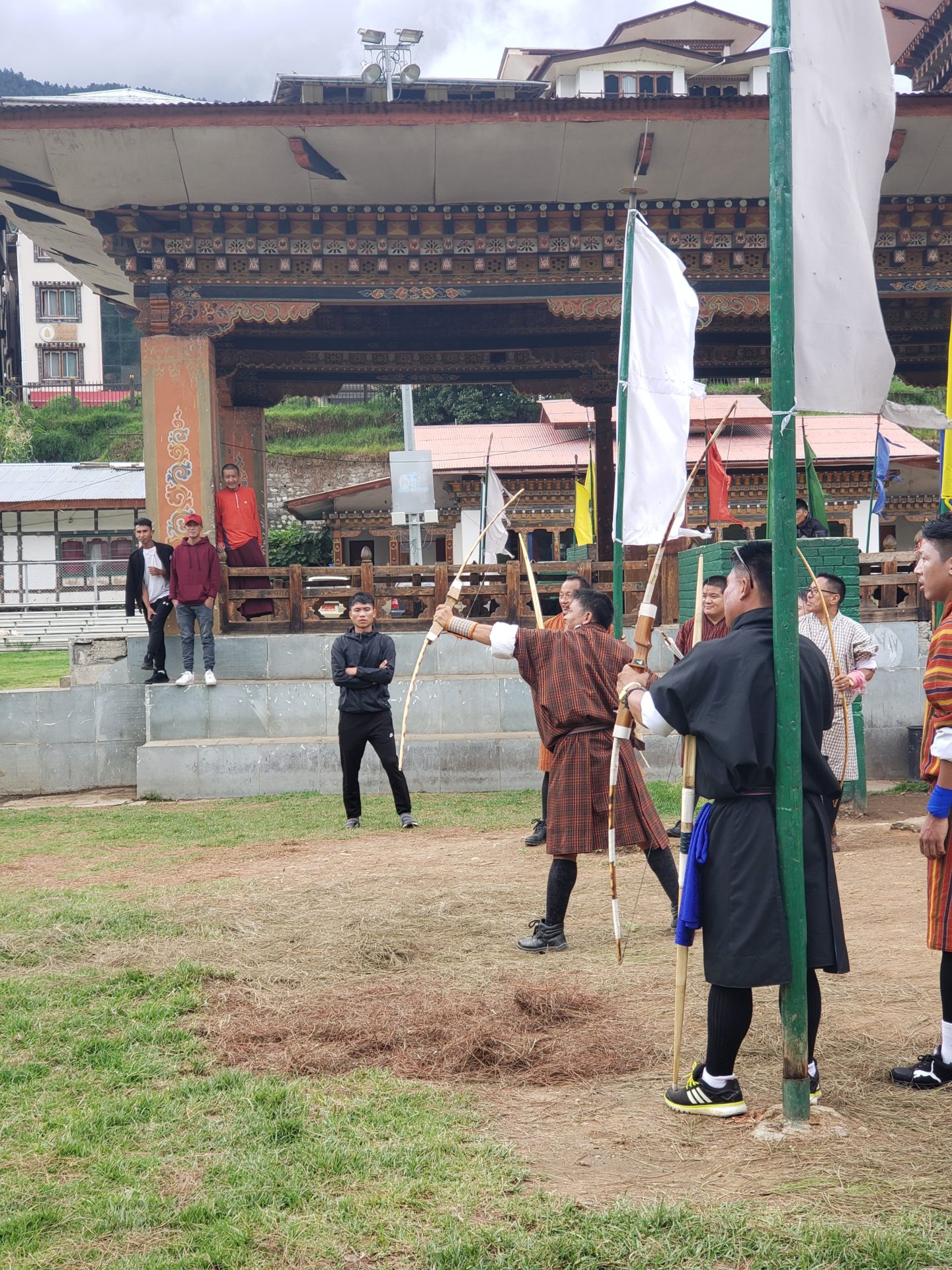 a group of people holding flags and arrows