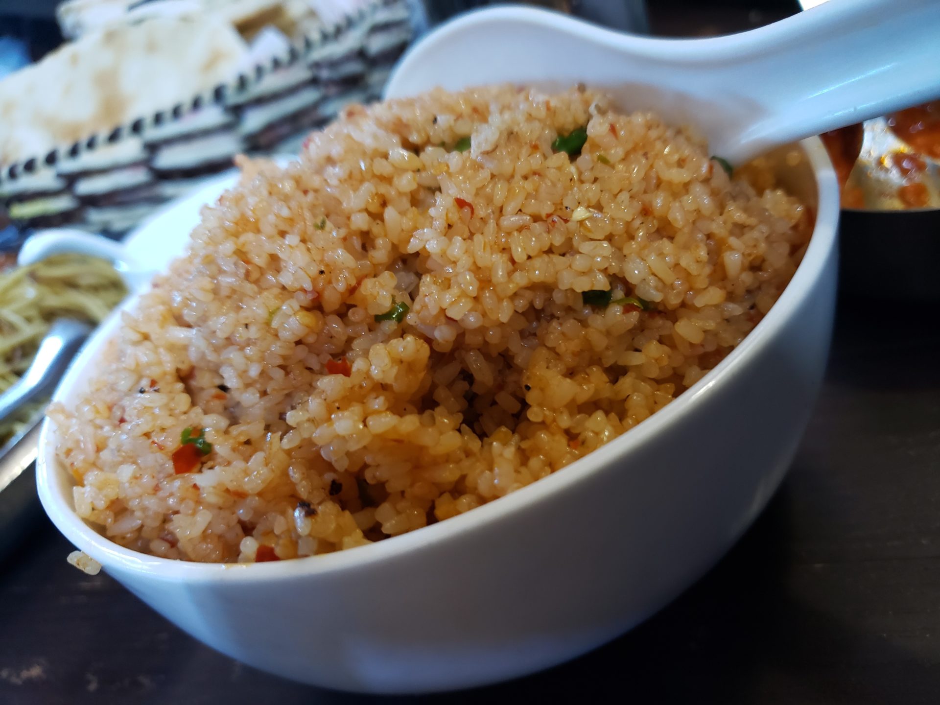 a bowl of rice with a spoon
