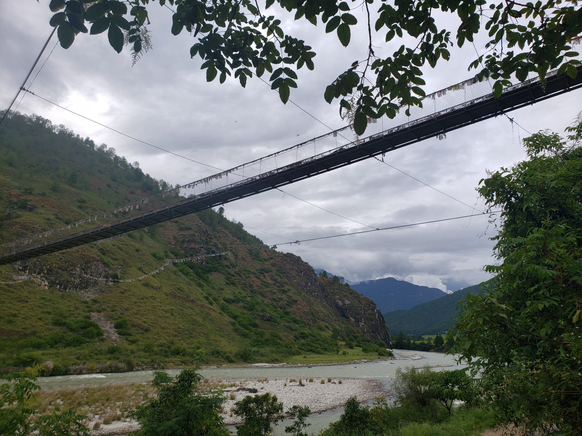 a suspension bridge over a river