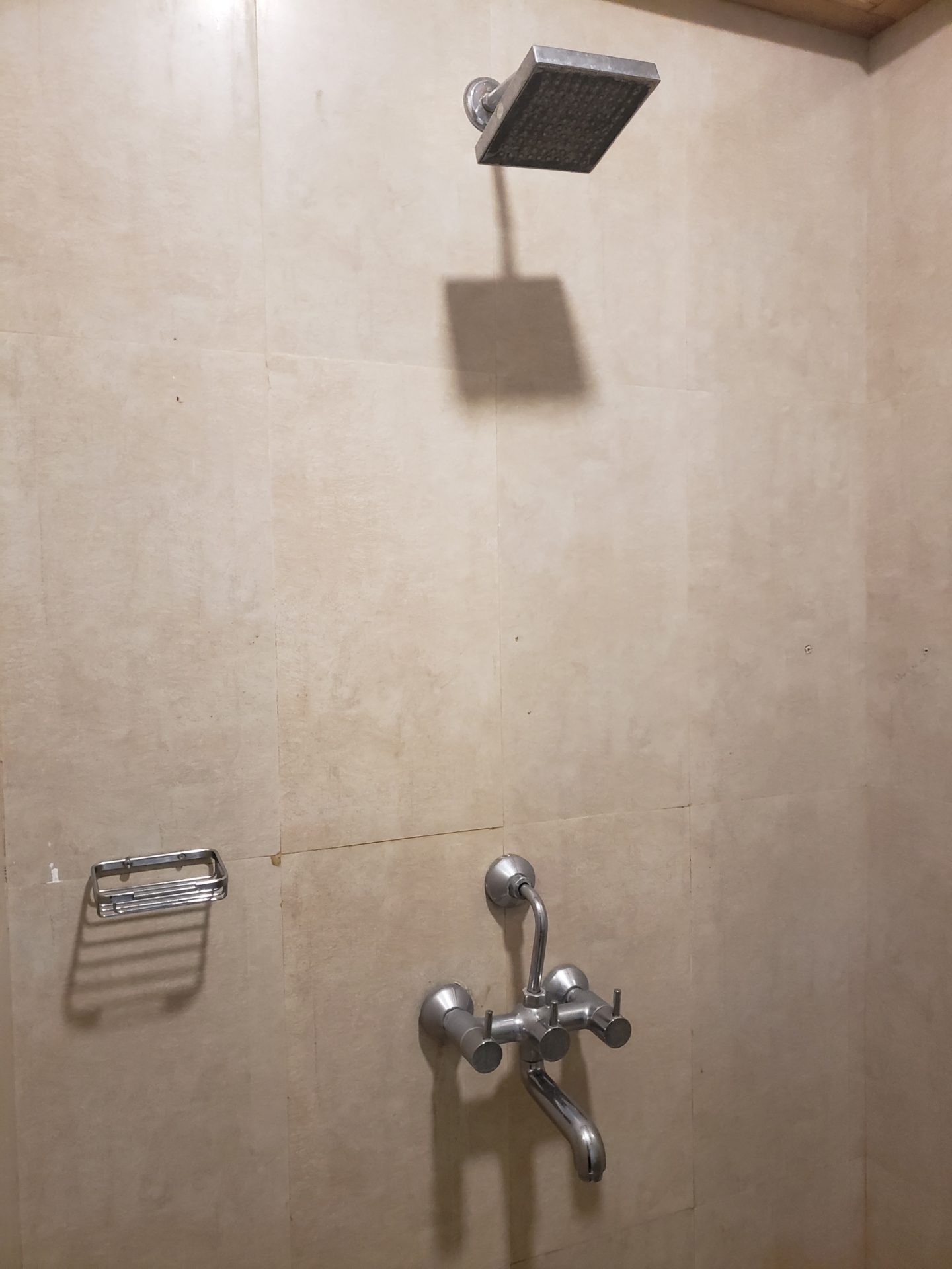 a shower head in a bathroom