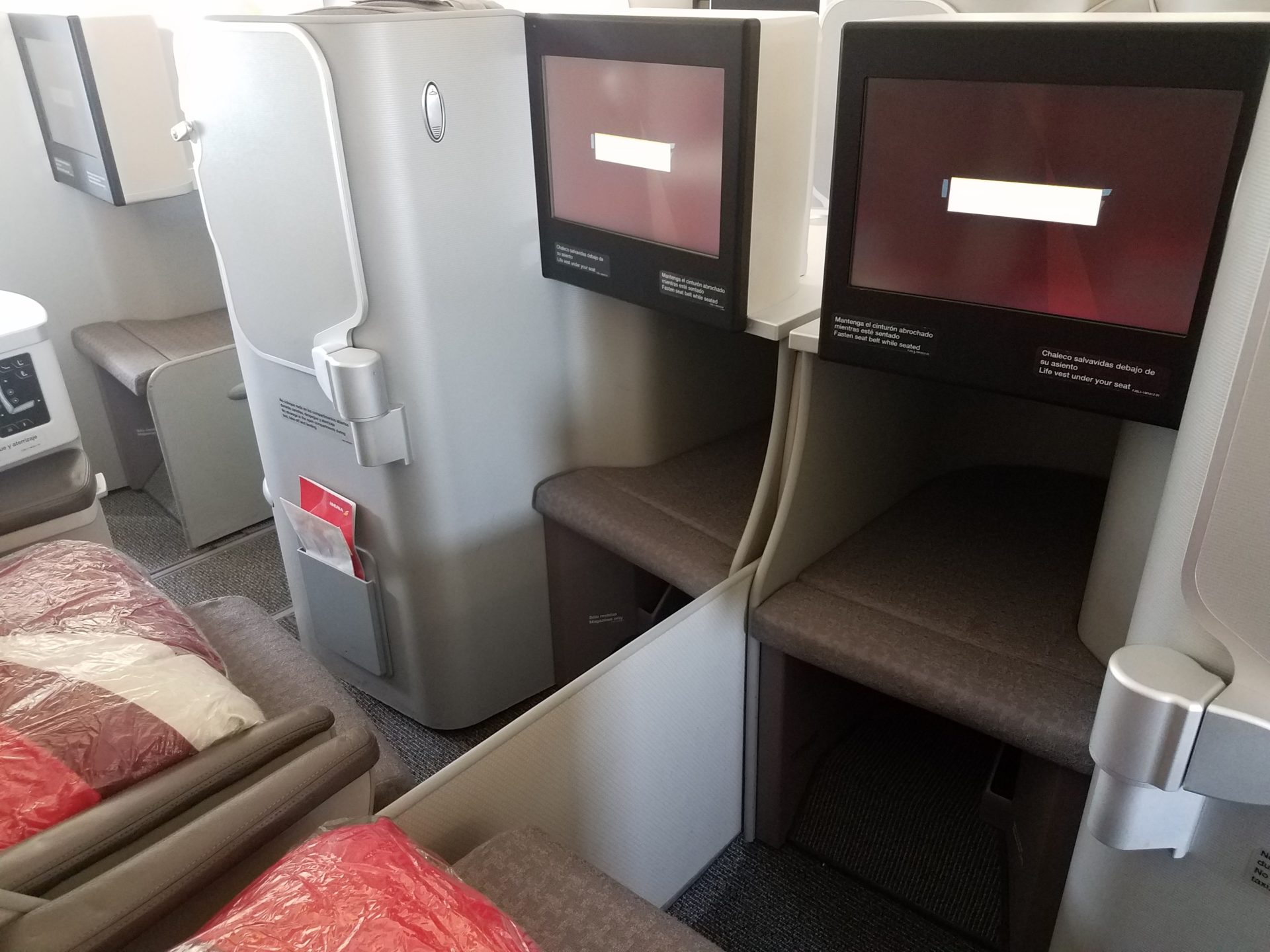 a two monitors on a plane