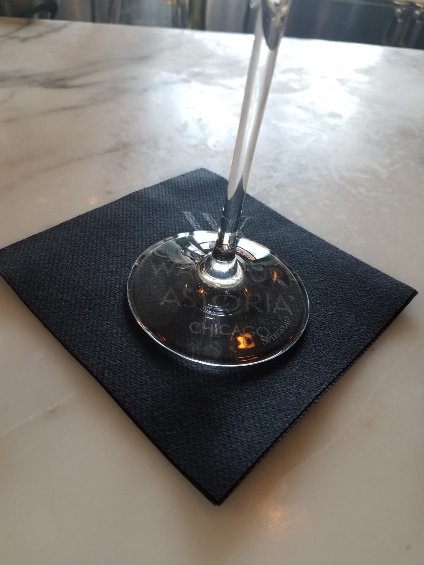 a glass on a napkin