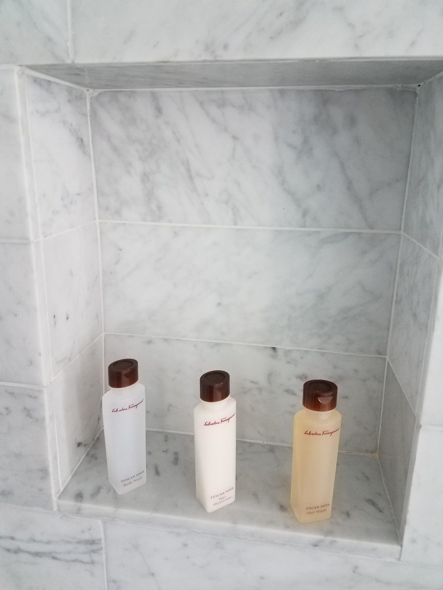 a group of bottles in a shower