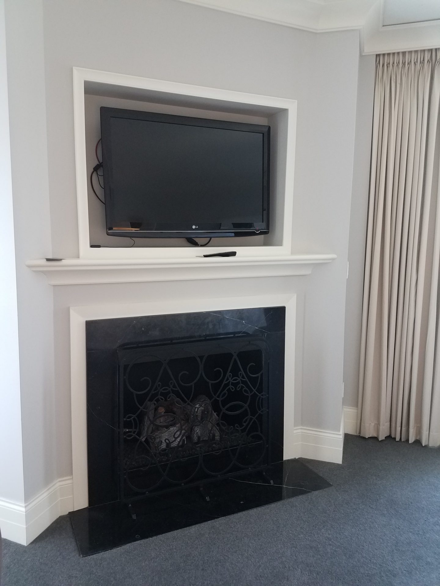a tv on a fireplace