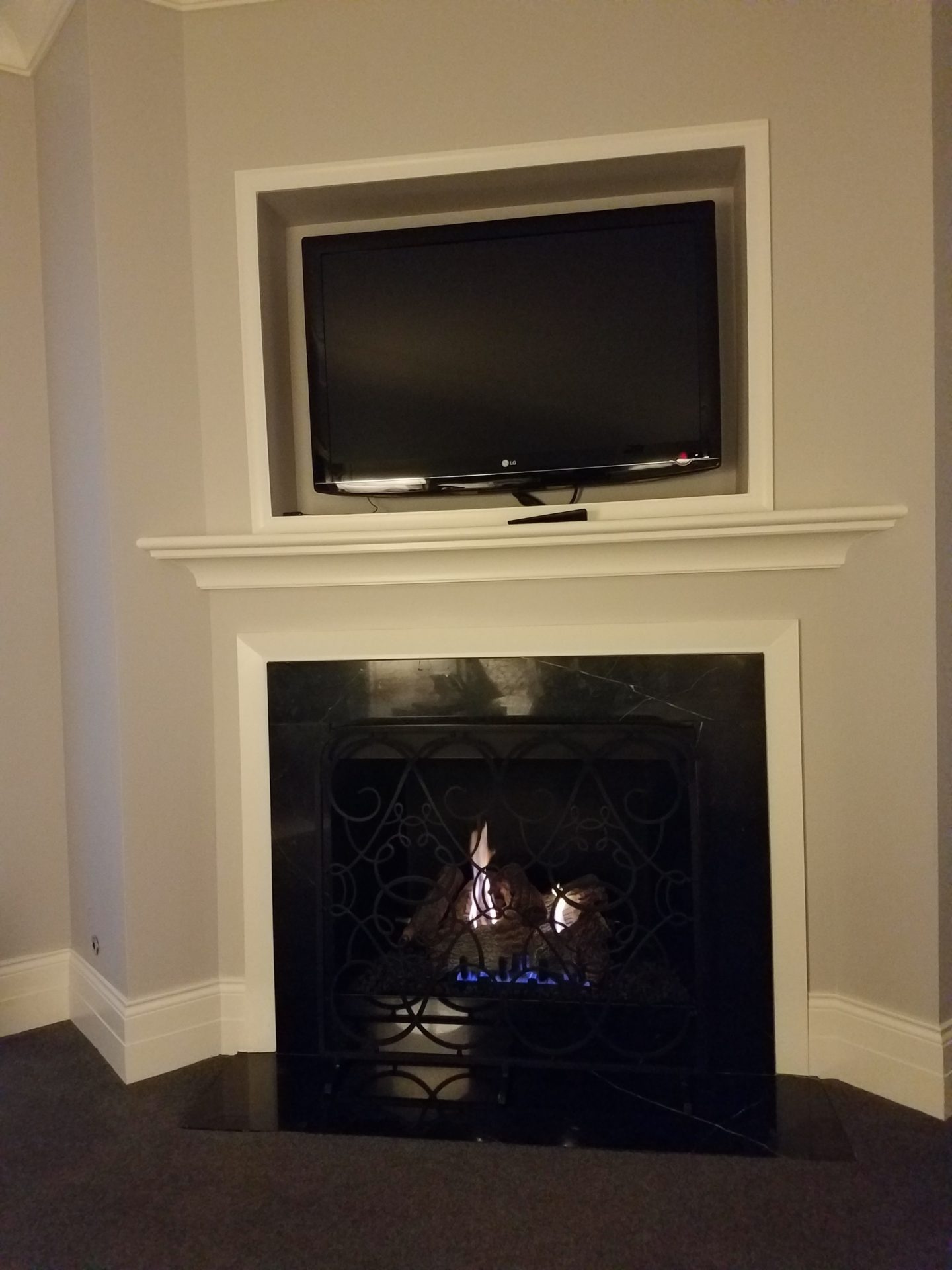 a tv above a fireplace