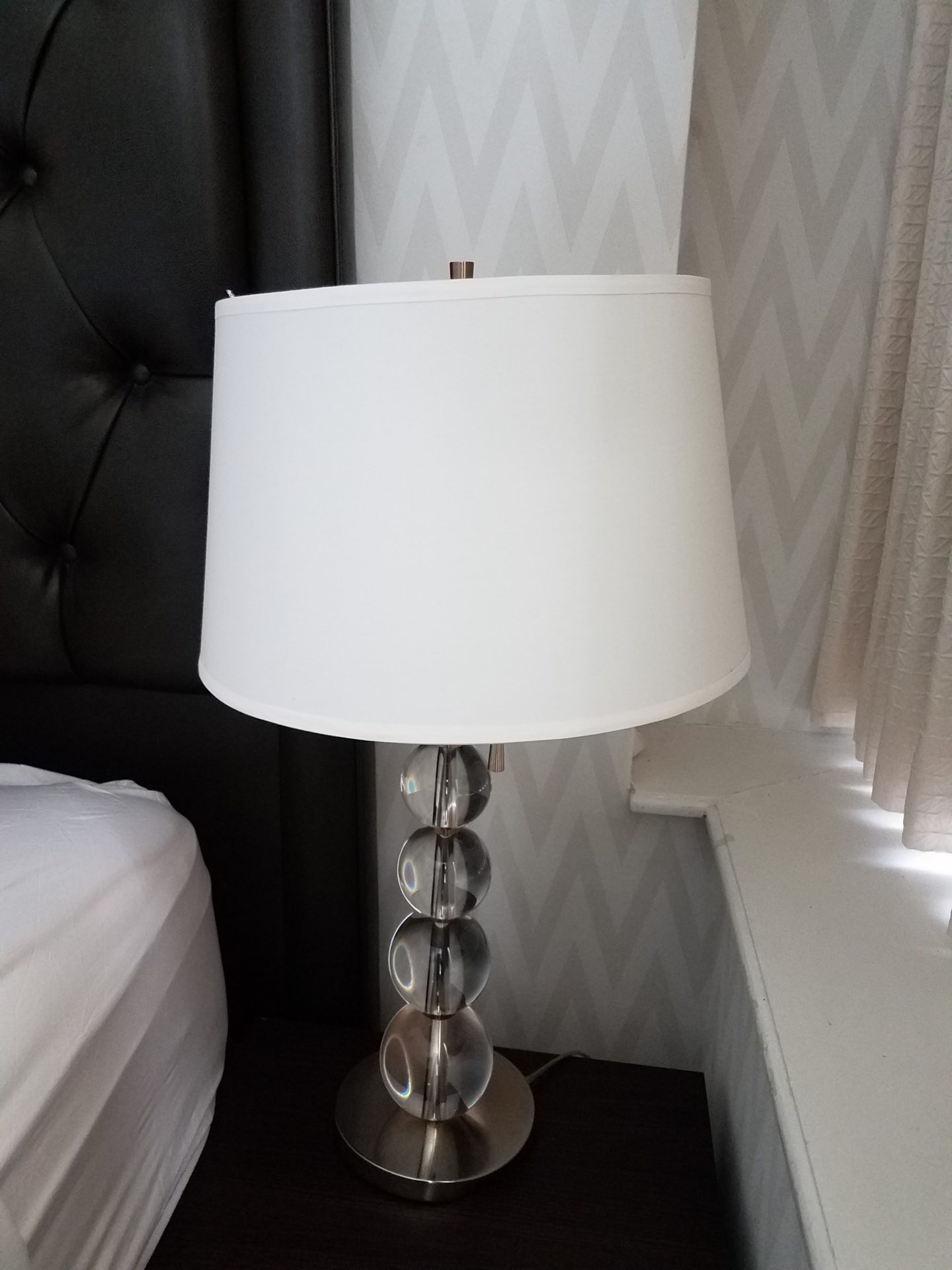 a lamp with a white shade