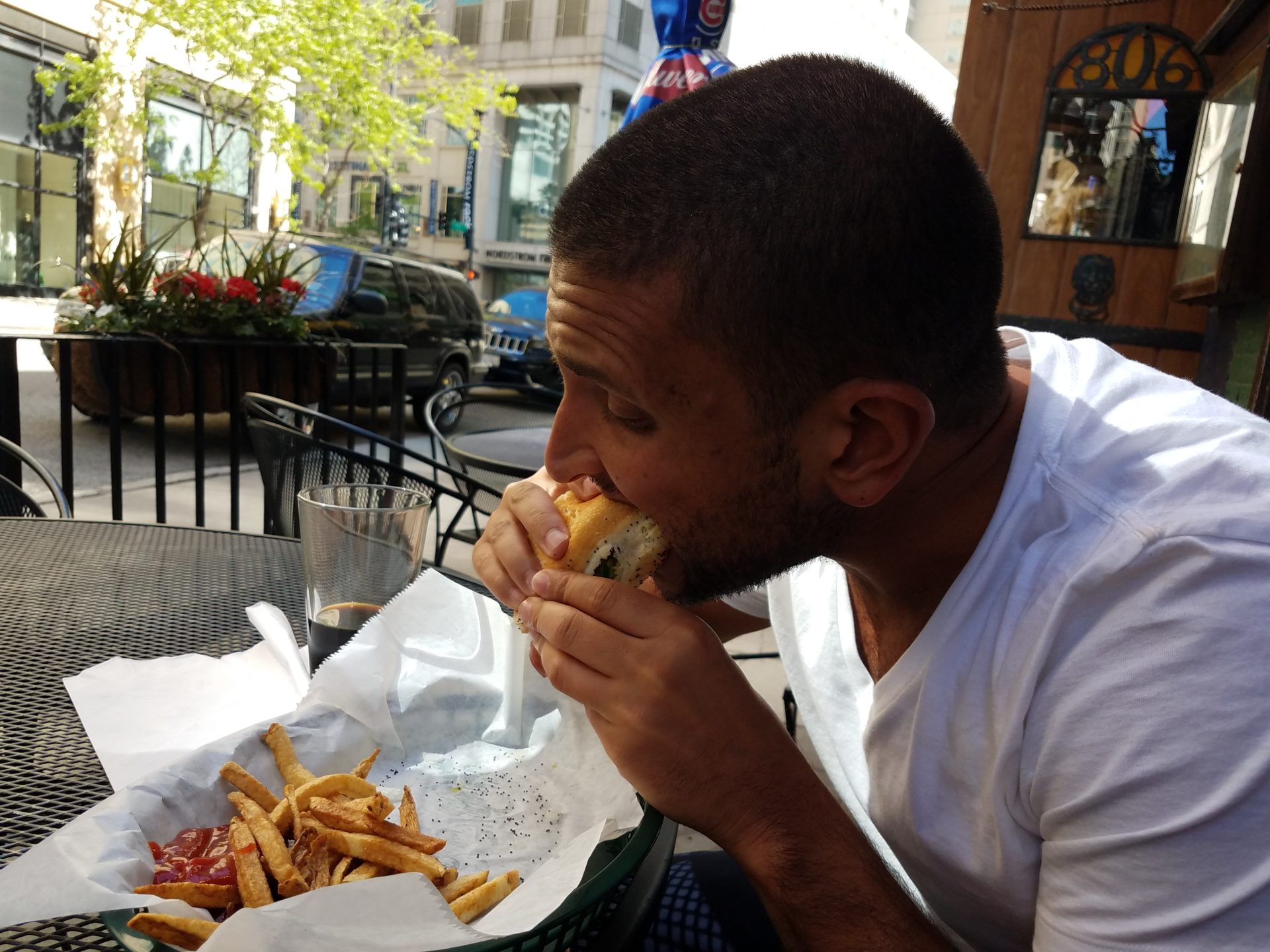 a man eating a hot dog